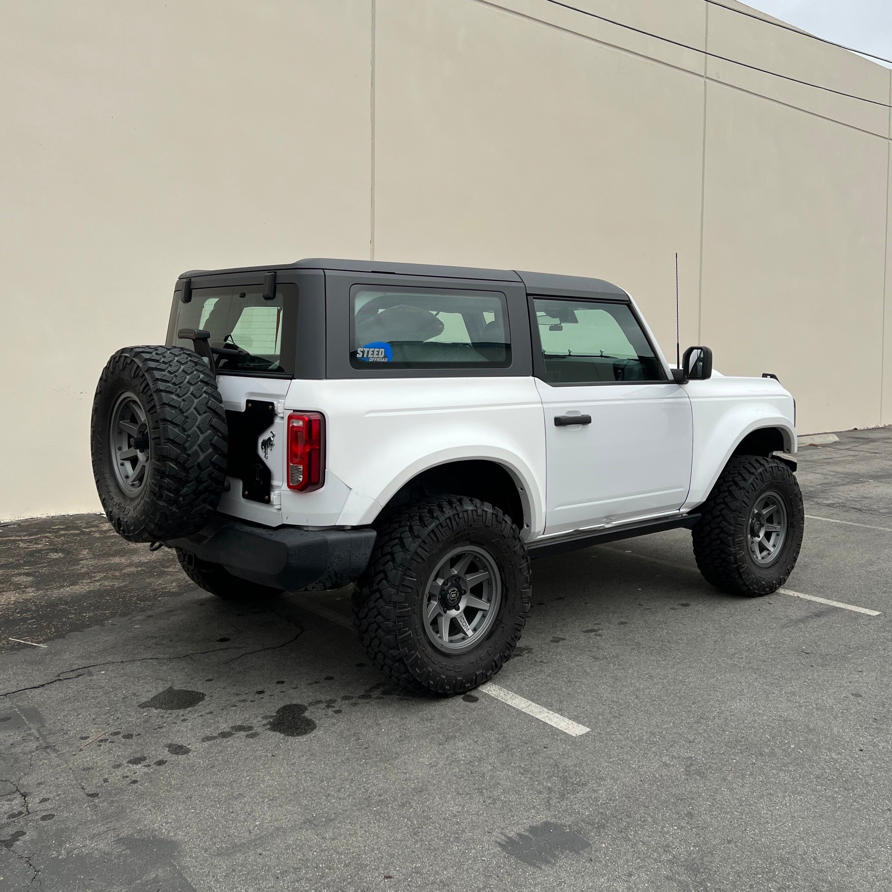 2021-2025 Ford Bronco 2-Door with rear quarter kit, showcasing rugged design and off-road capabilities.