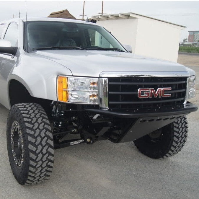 2007-2013 GMC Sierra fenders on a lifted truck with offroad tires, showcasing rugged design and enhanced performance.