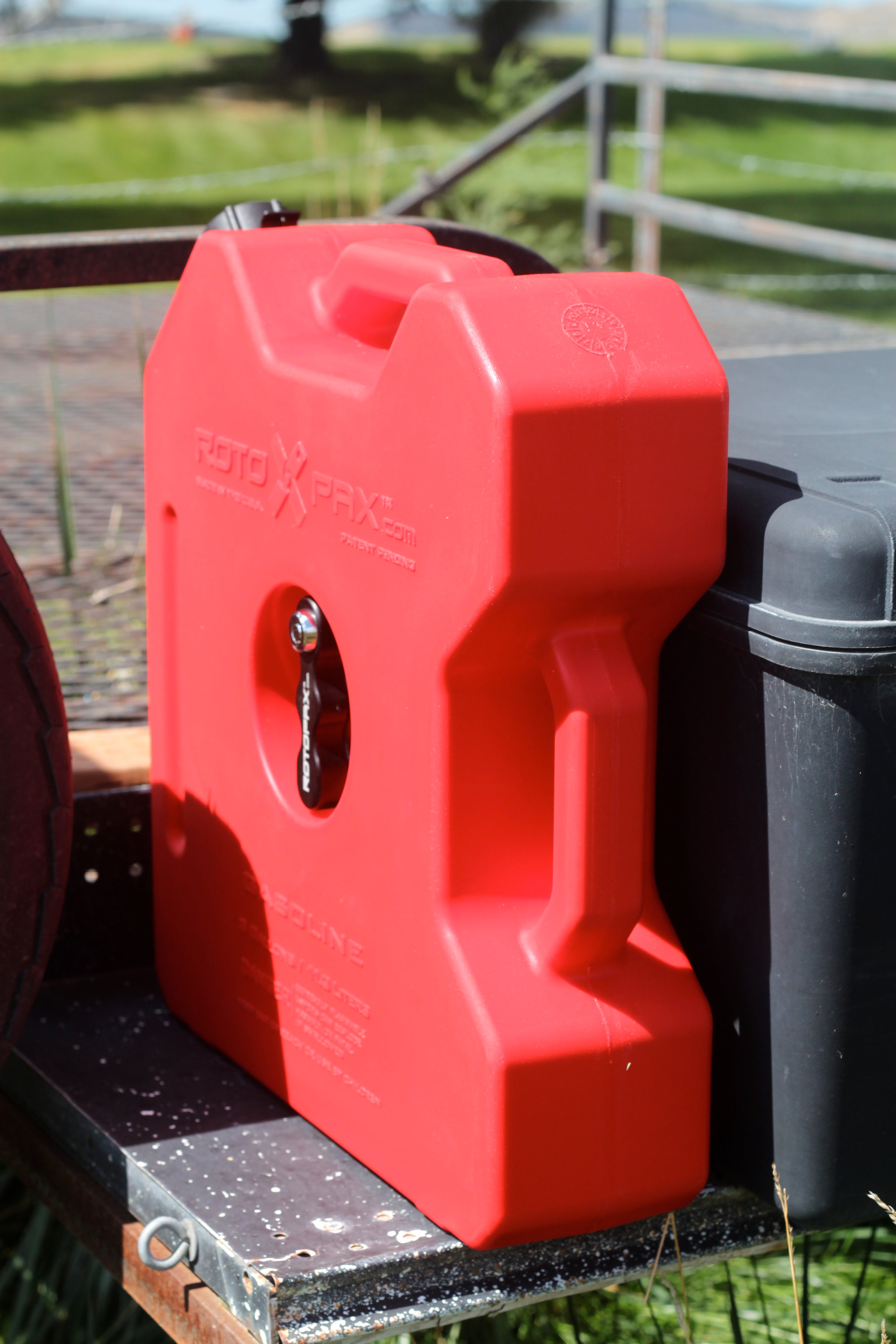 Red 3-gallon Rotopax fuel container designed for offroad vehicles, featuring a sturdy handle and secure cap for easy transport.