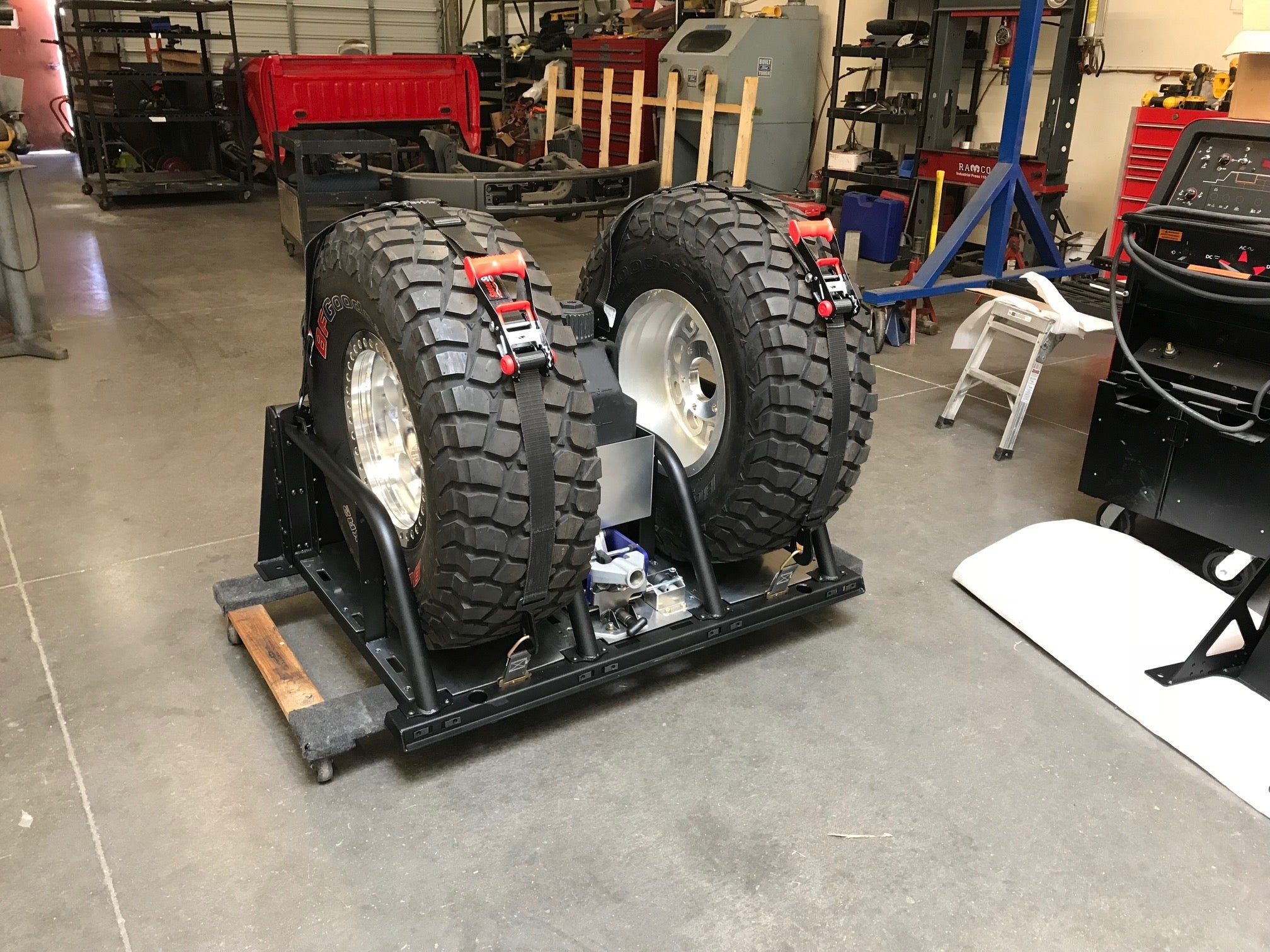 Modular bed organizer for 2017-2024 Ford Raptor featuring a slide-out cargo tray and dual tire storage.