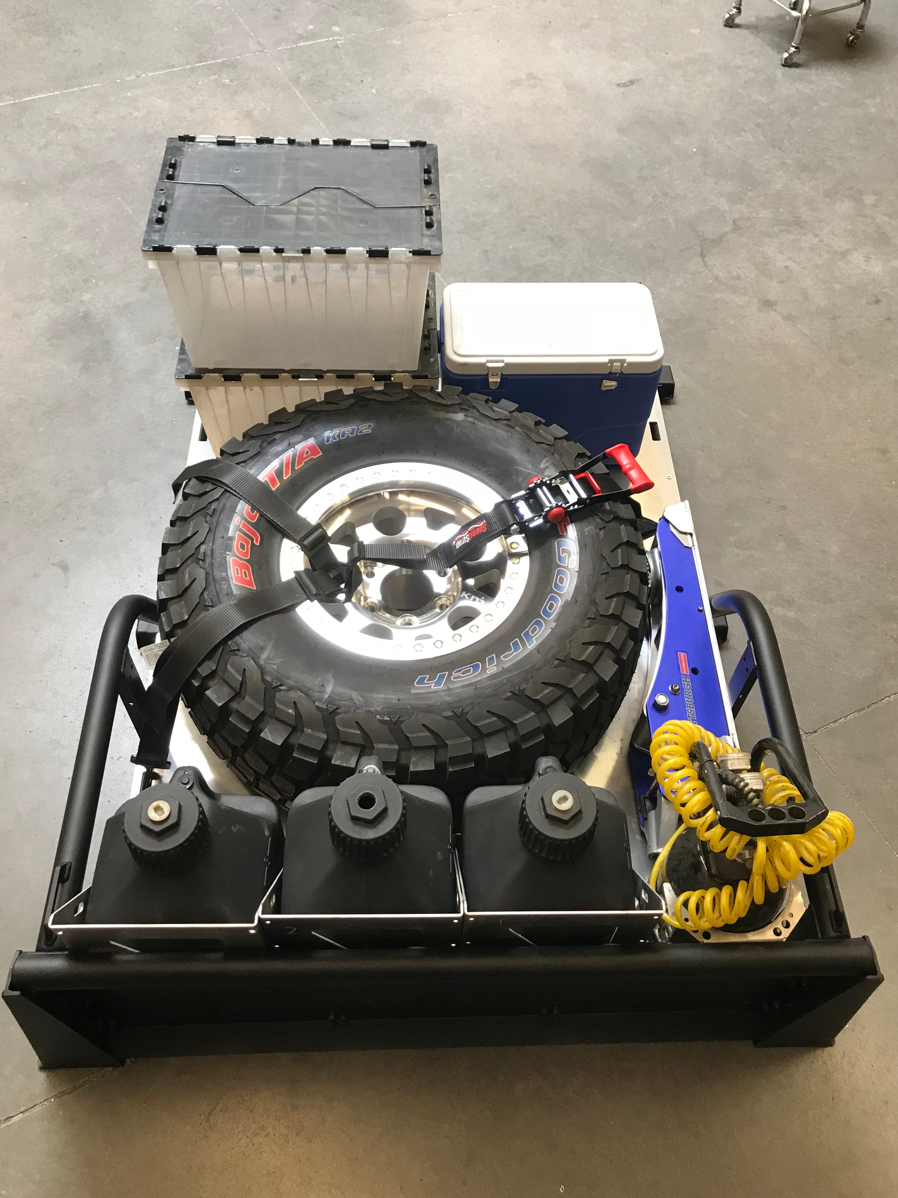 Modular bed organizer for 2017-2024 Ford Raptor and F150, featuring tire storage, tool compartments, and secure straps.