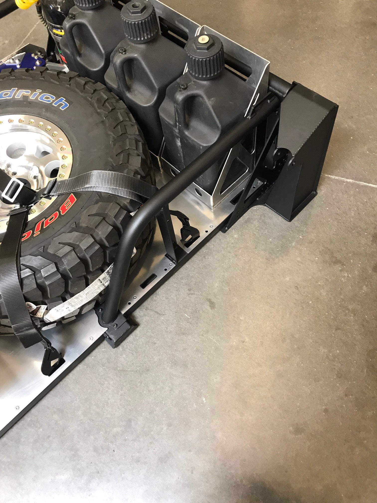 20-inch rear travel bed organizer kit for 2017-2020 Raptor, featuring secure tire and storage container mounts.