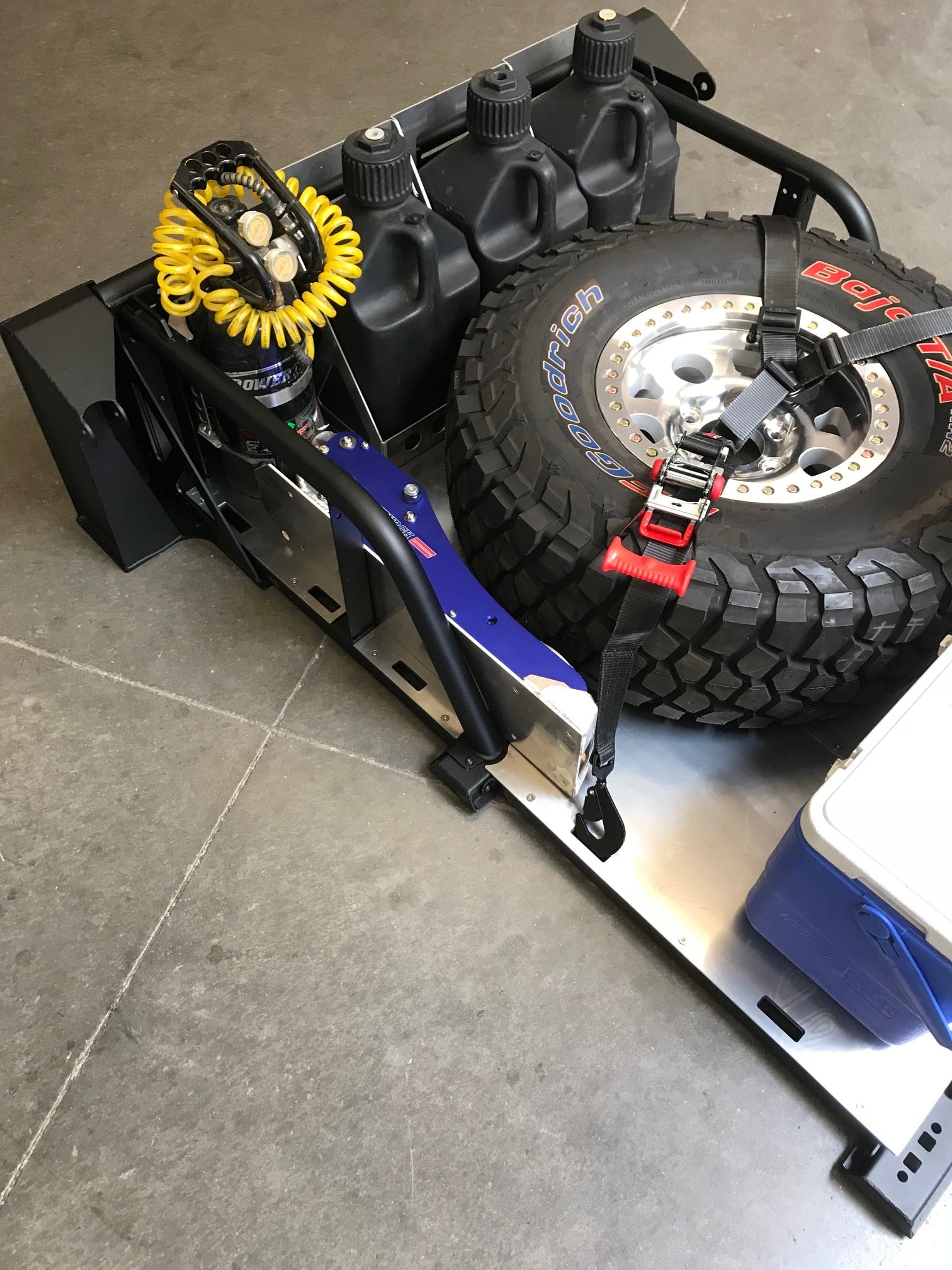 Modular bed organizer for 2017-2024 Ford Raptor and F150, featuring storage for tools, tires, and accessories.