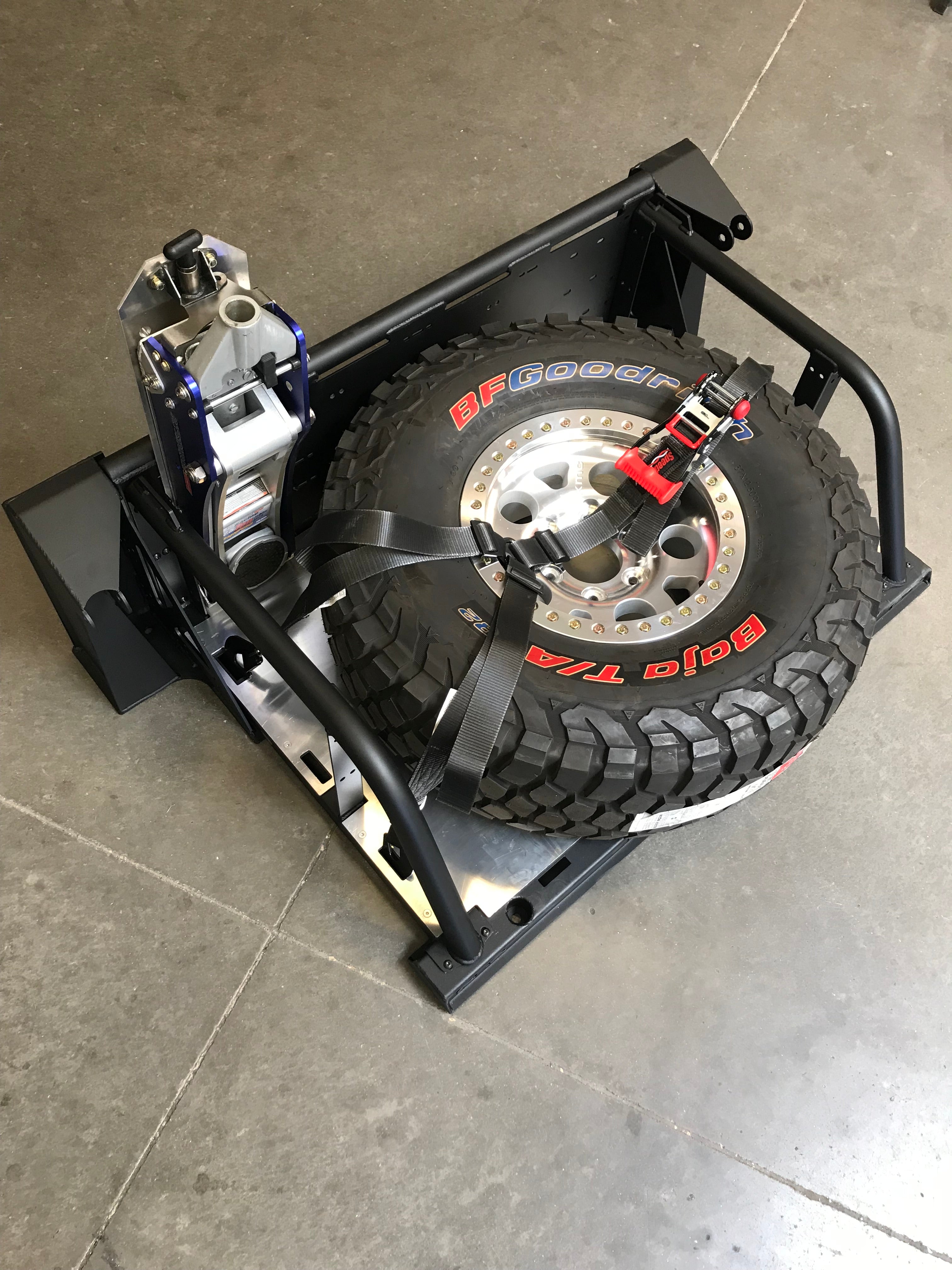 Modular bed organizer for 2017-2024 Ford Raptor featuring a slide-out cargo tray and secure tire storage.