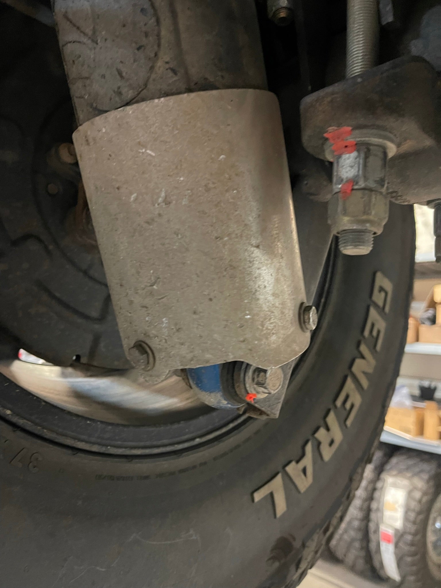 Rear shock guard for 2017-2024 Ford Raptor, designed to protect shock components from damage.