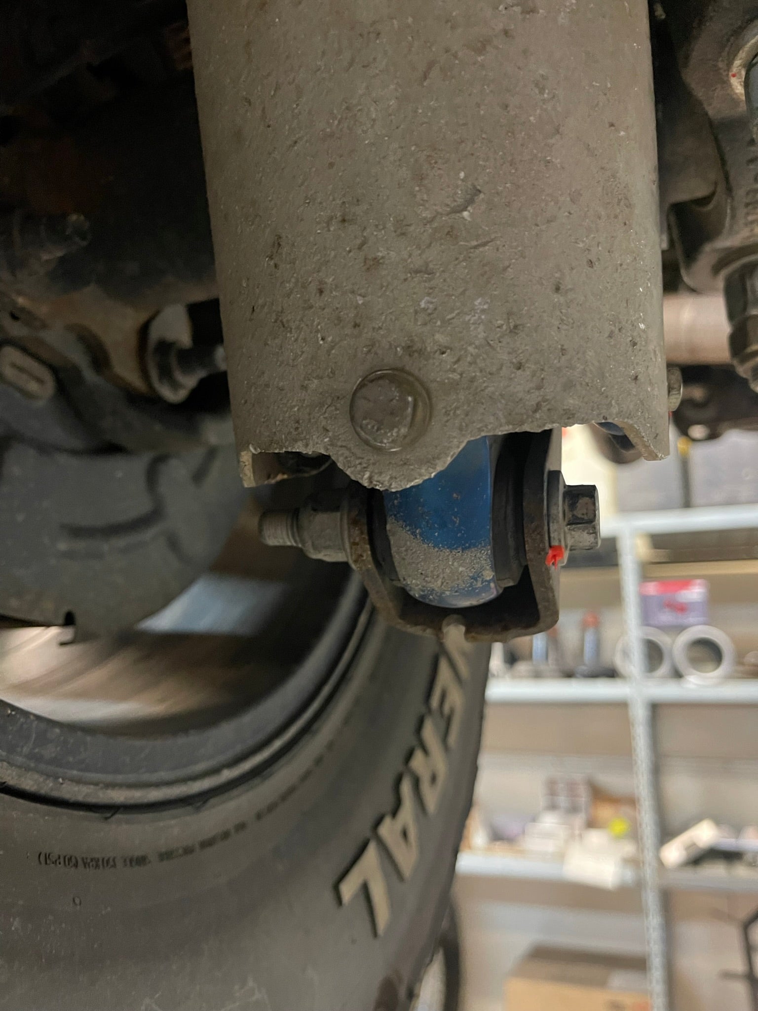 Rear shock guard for 2017-2024 Ford Raptor, showcasing protective features and mounting details. Ideal for offroad performance.