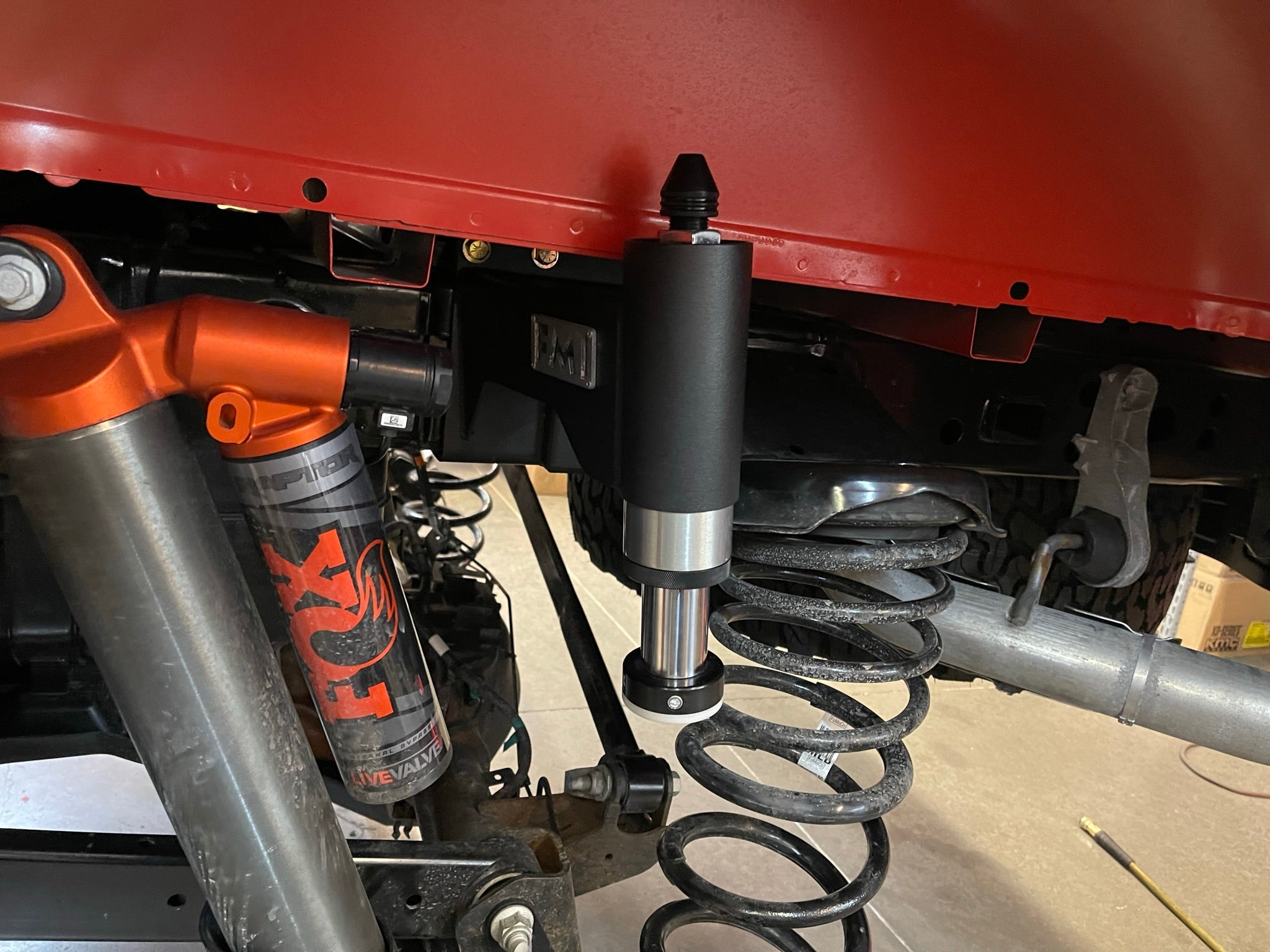 Rear bump stop kit installed on a 2021-2024 Ford Raptor, showcasing suspension components for offroad performance.