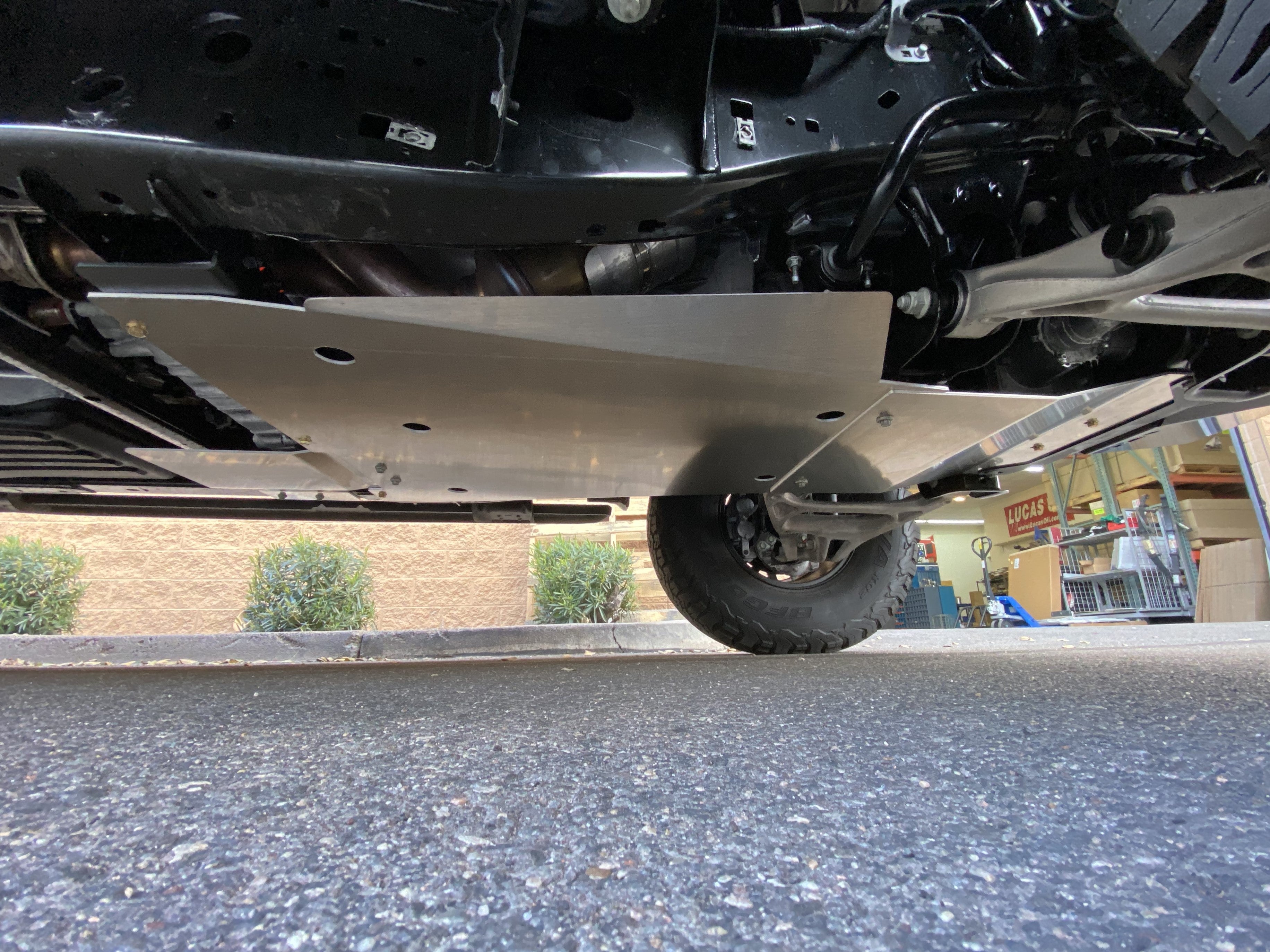 Skid plate kit installed on a 2017-2024 Ford Raptor, providing undercarriage protection for off-road driving.
