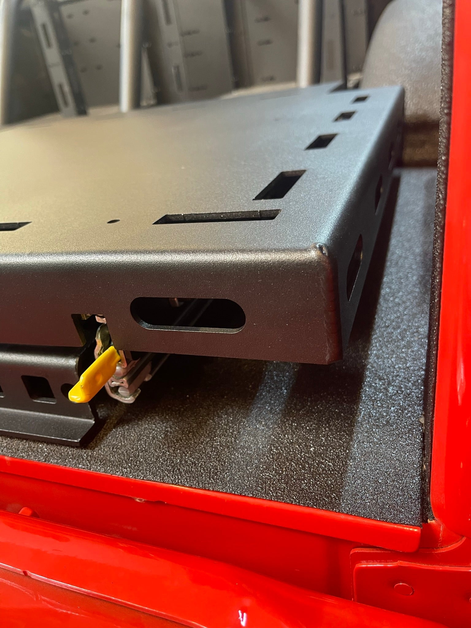 Raptor rear bed organizer with ADD on rear cargo slide tray, showcasing durable construction and convenient access features.