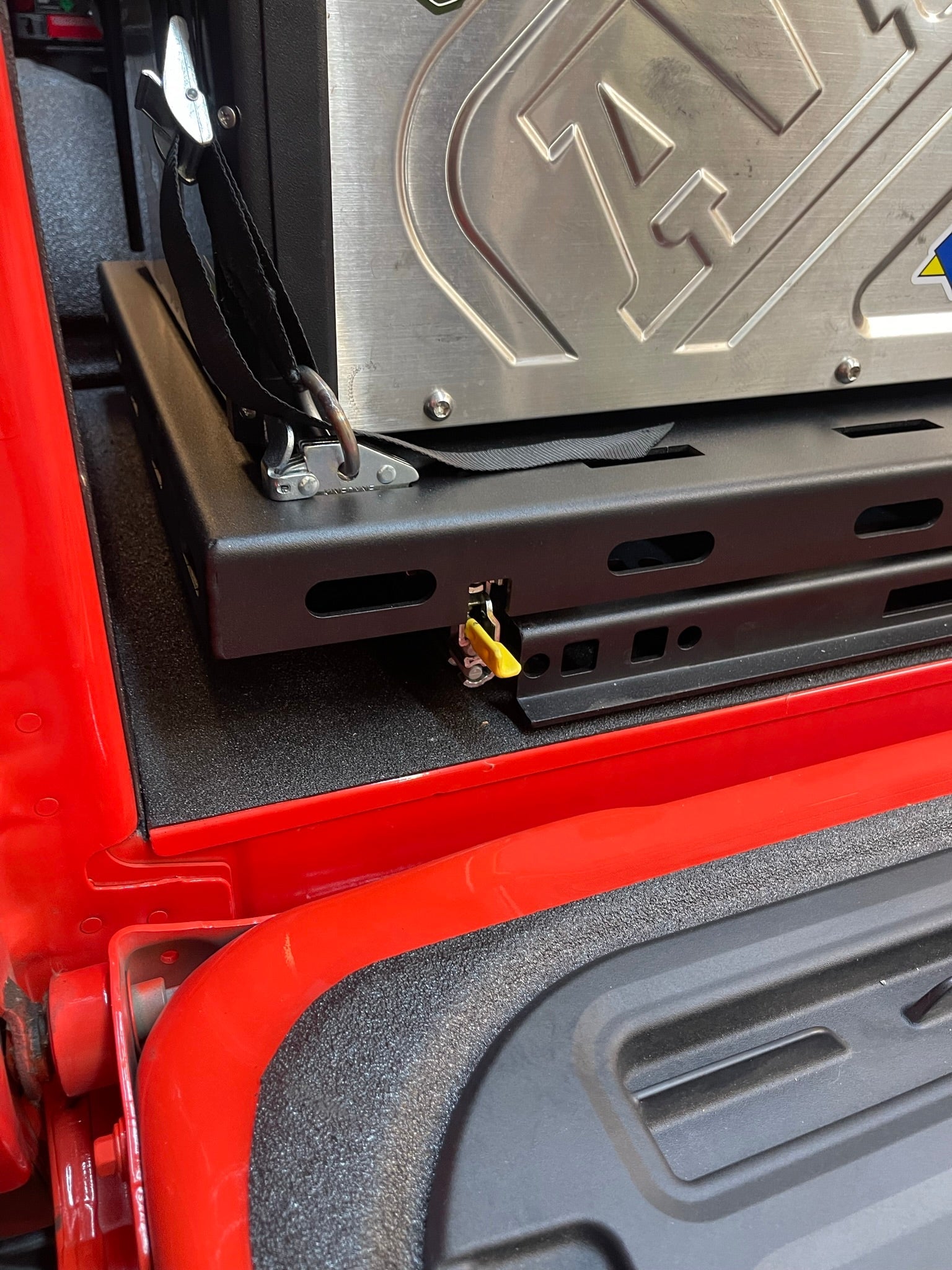 Rear bed organizer for 2017-2024 Raptor with cargo slide tray, showcasing secure storage and easy access features.