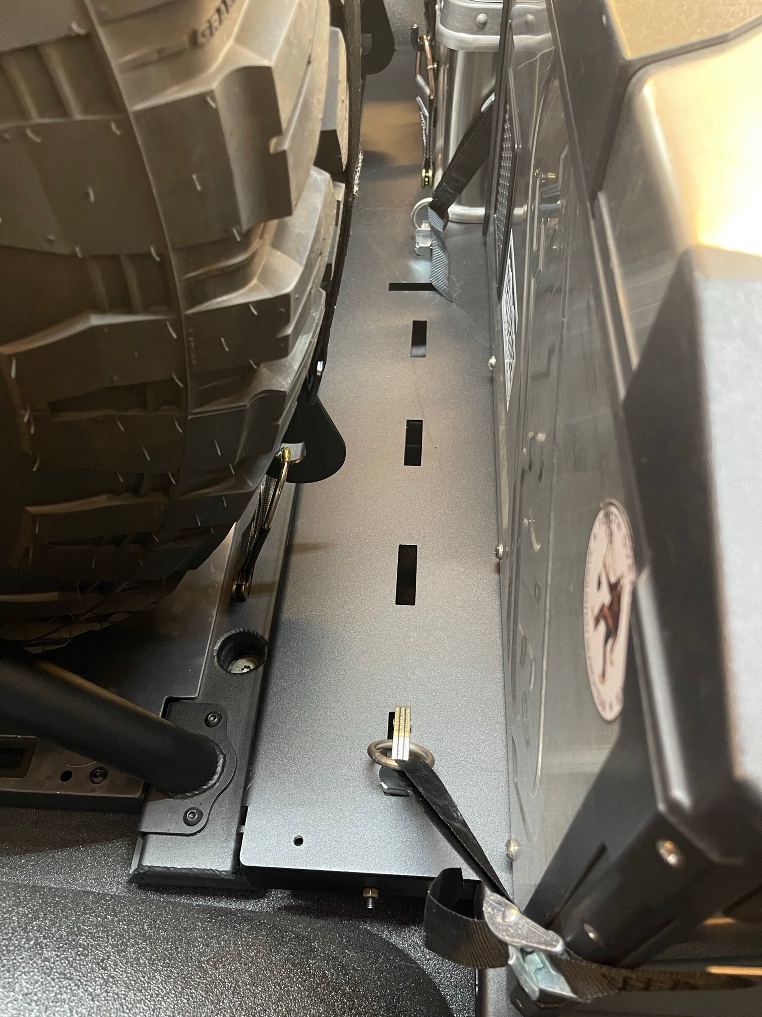 Raptor rear bed organizer with cargo slide tray, designed for 2017-2024 models, showcasing durable metal construction.
