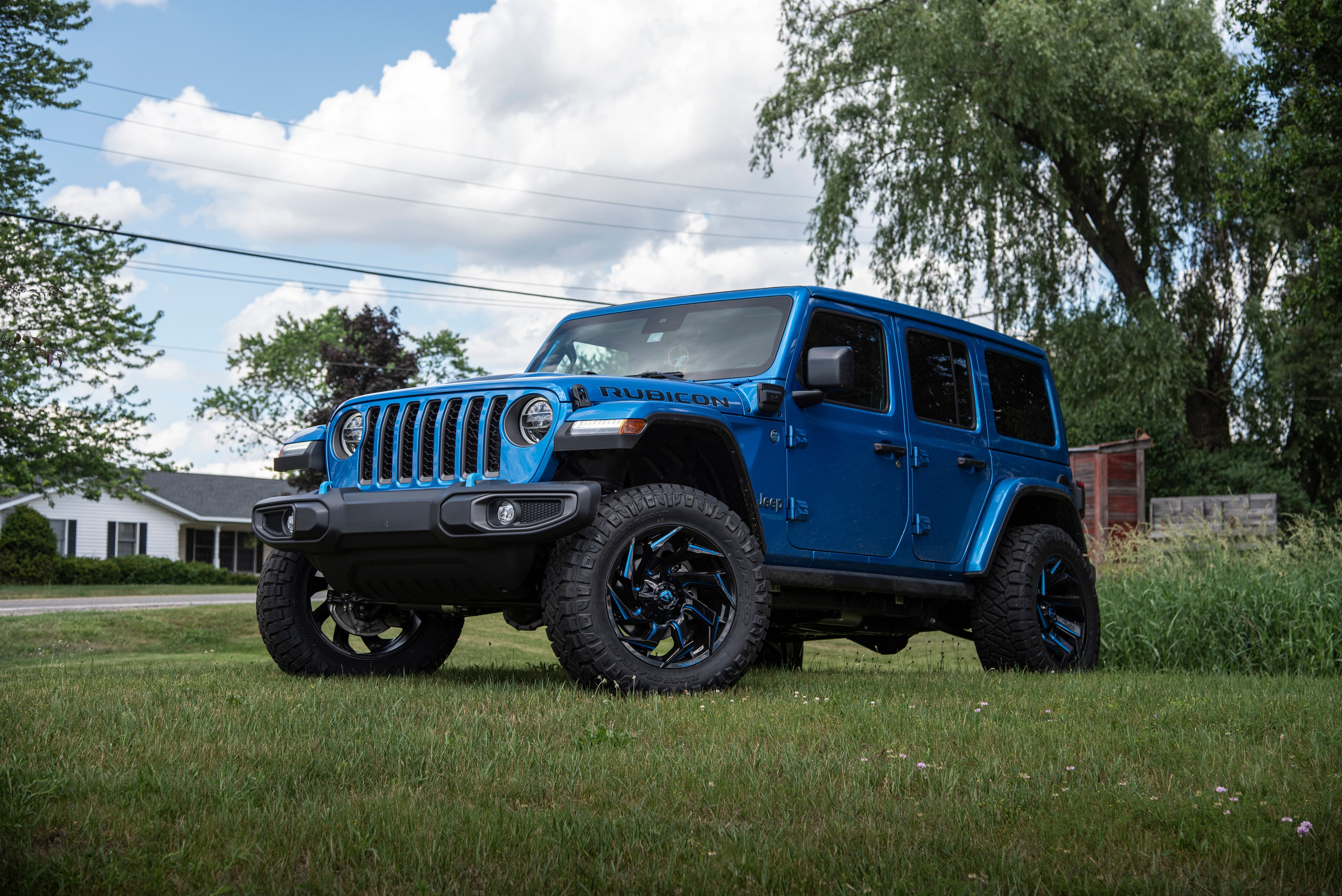 3-inch lift kit for Jeep Wrangler JL 4xe, enhancing off-road capability and aggressive stance with stylish wheels.