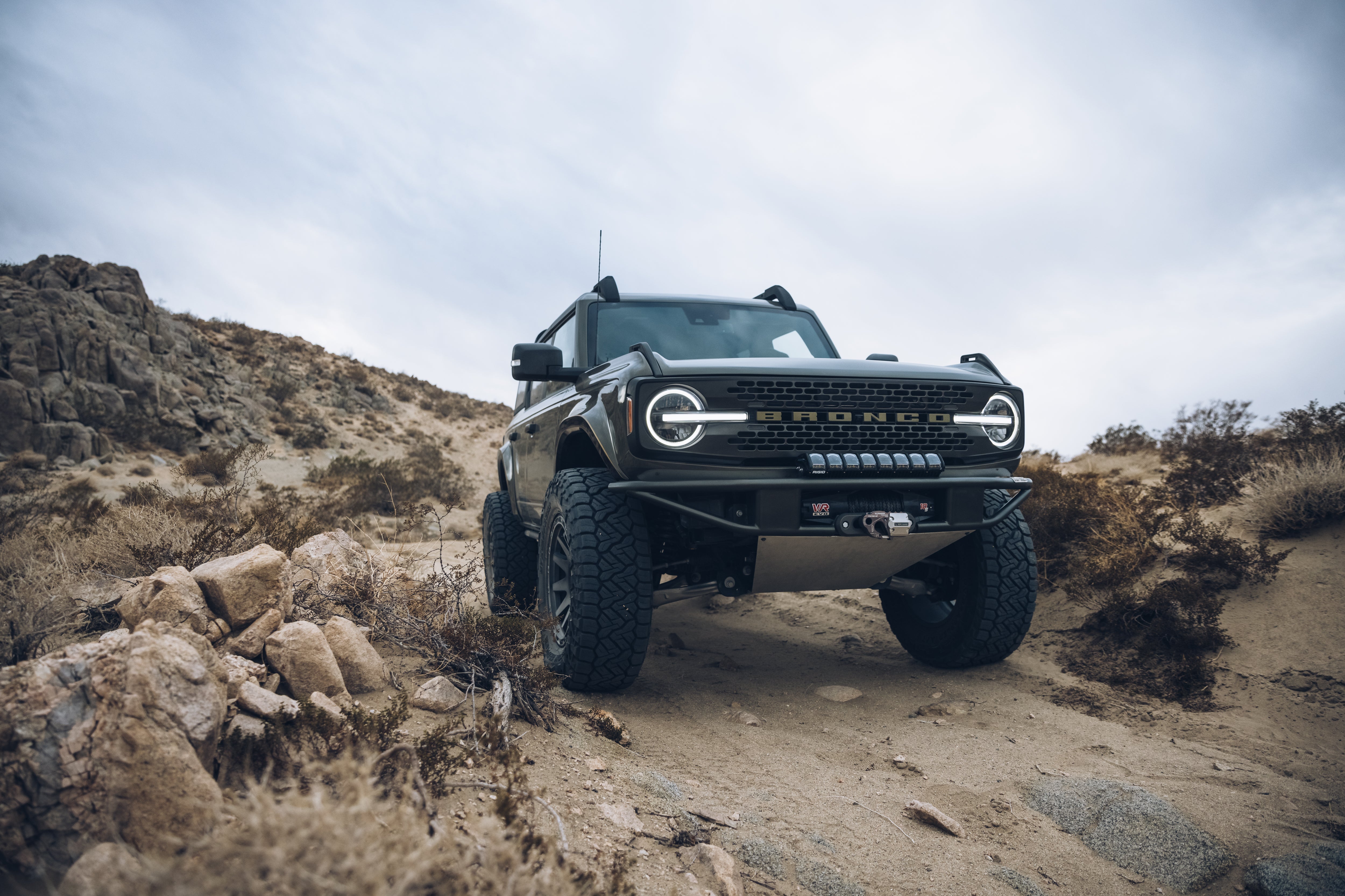 2021 Outer Banks Bronco with Baja Forged accessories, showcasing rugged off-road capabilities in a desert landscape.