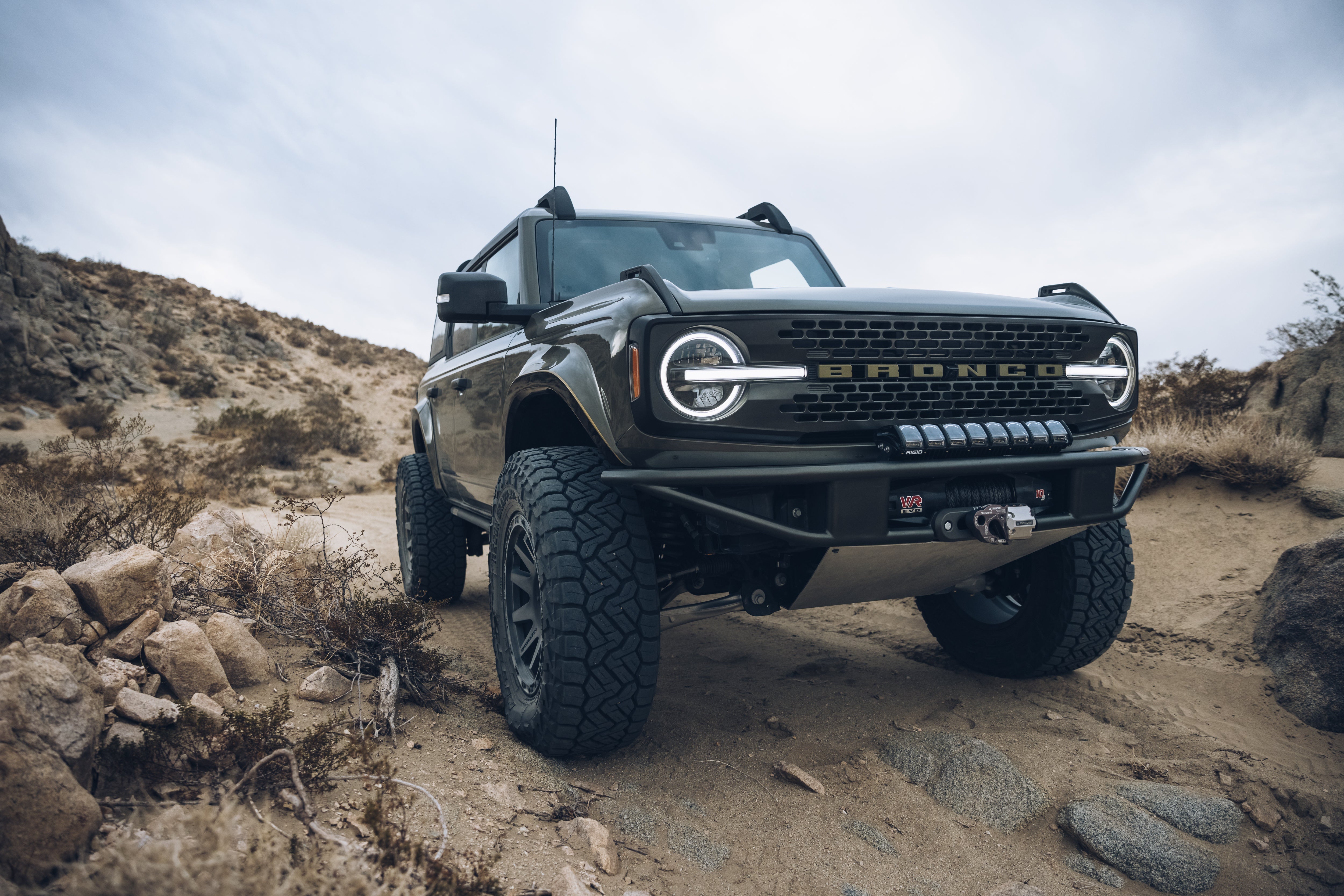 2021 Outer Banks Bronco with BAJA FORGED accessories, showcasing rugged off-road capability in a desert landscape.