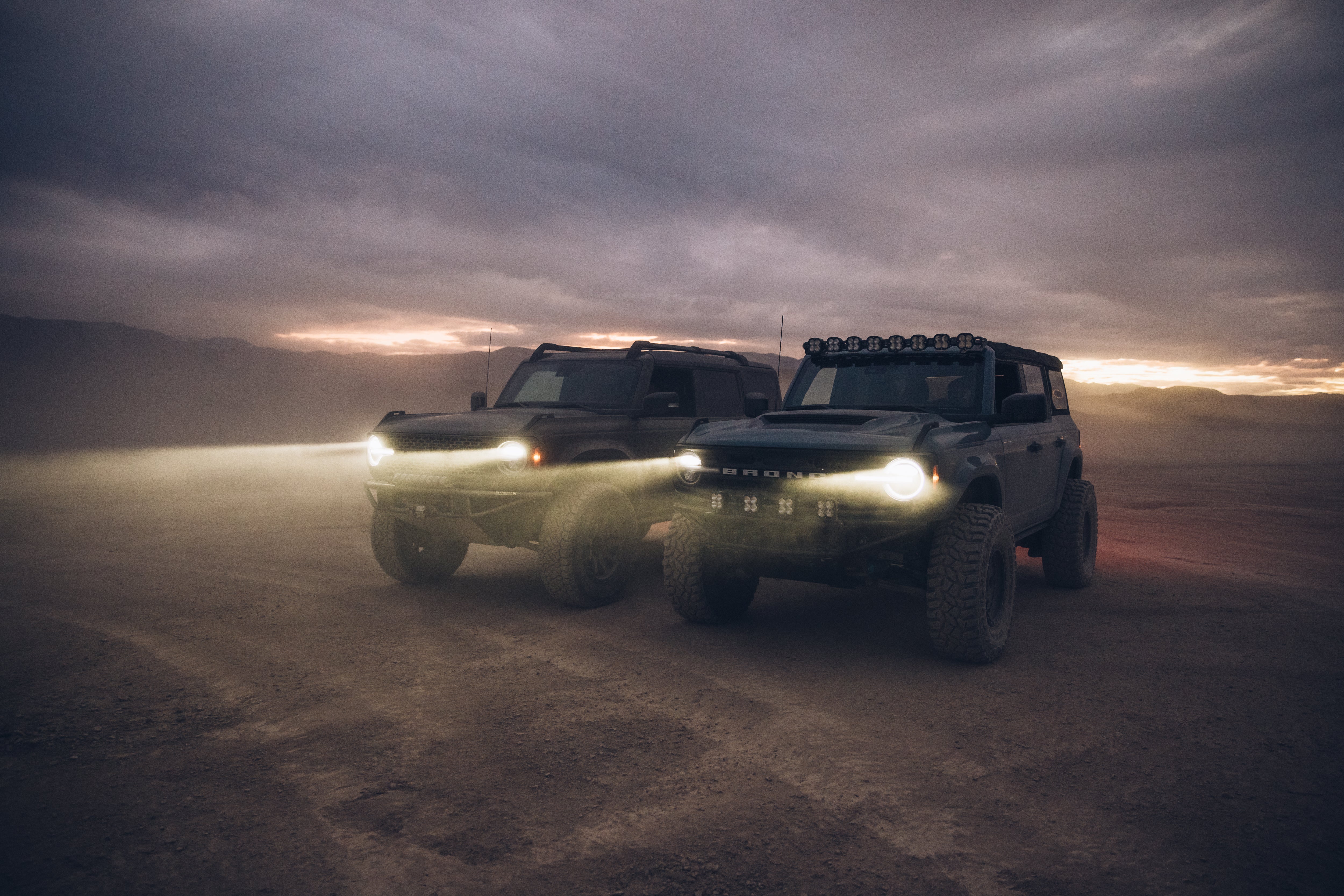 ADV Fiberglass 2021 Ford vehicles in a desert setting, showcasing rugged design and off-road capabilities.
