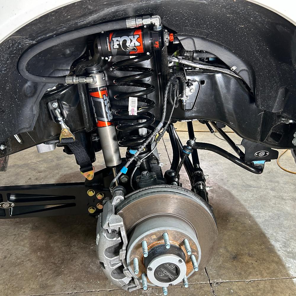 2.5-inch fully loaded suspension kit installed on a 2023 Ford F250/F350 showcasing Fox shocks and components.