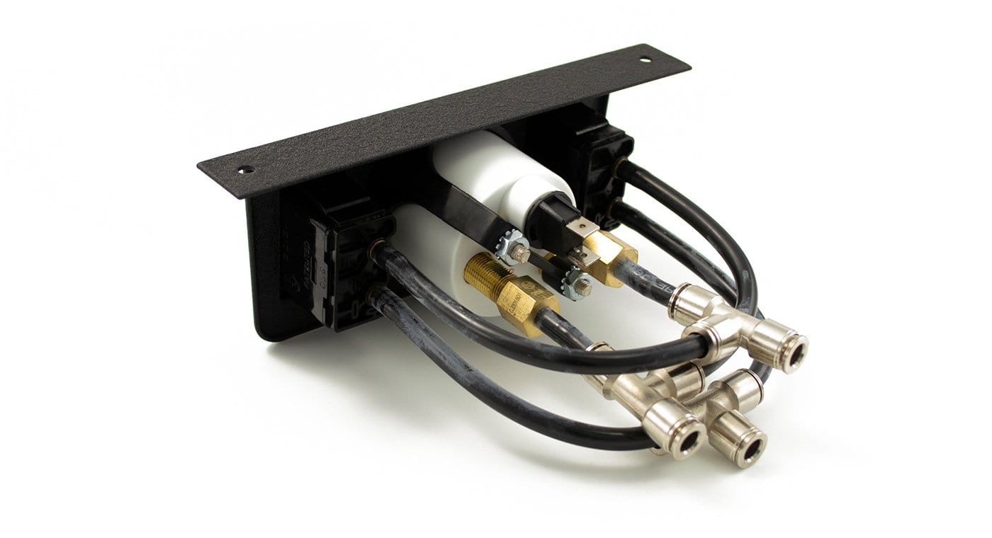 Air Lift dual needle gauge panel with dual paddle switches, featuring hoses and connectors for precise air pressure monitoring.