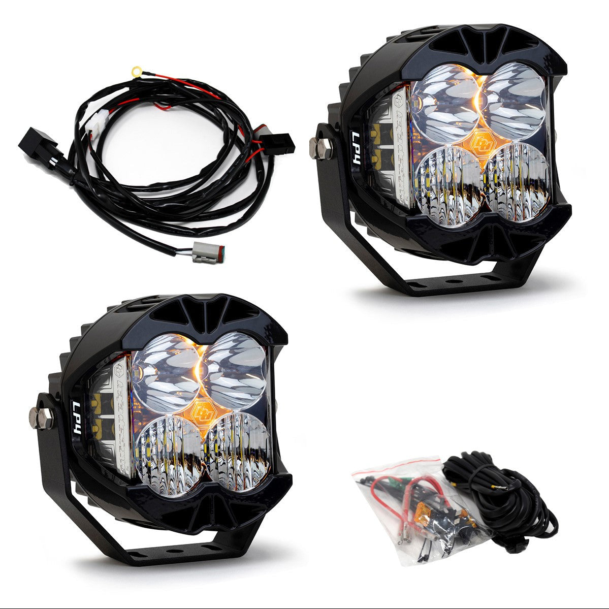 Baja Designs LP4 Pro LED light pair with wiring harness and installation accessories for offroad vehicles.