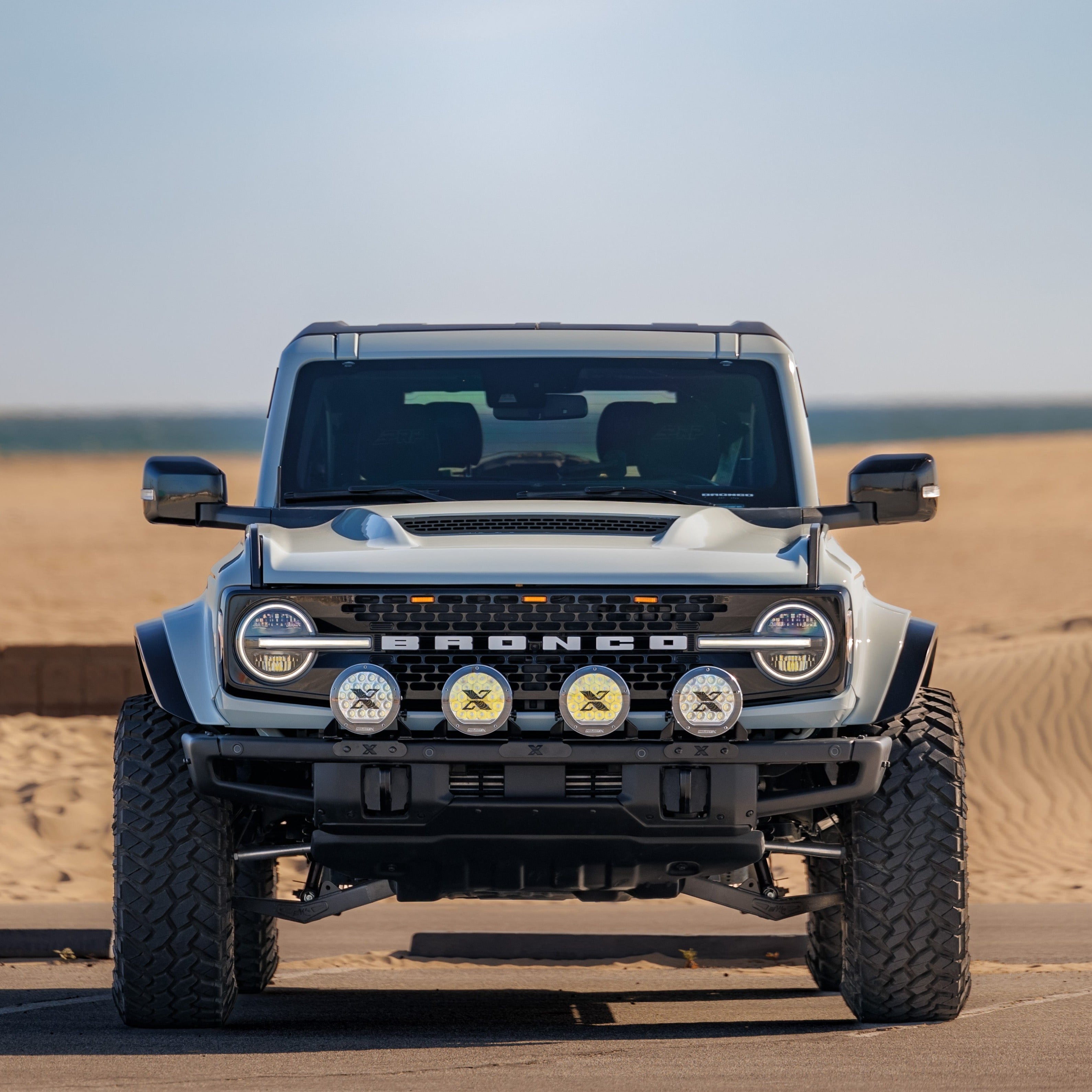 2021-2025 Ford Bronco with aftermarket fenders and off-road lights, showcasing rugged design and enhanced performance.