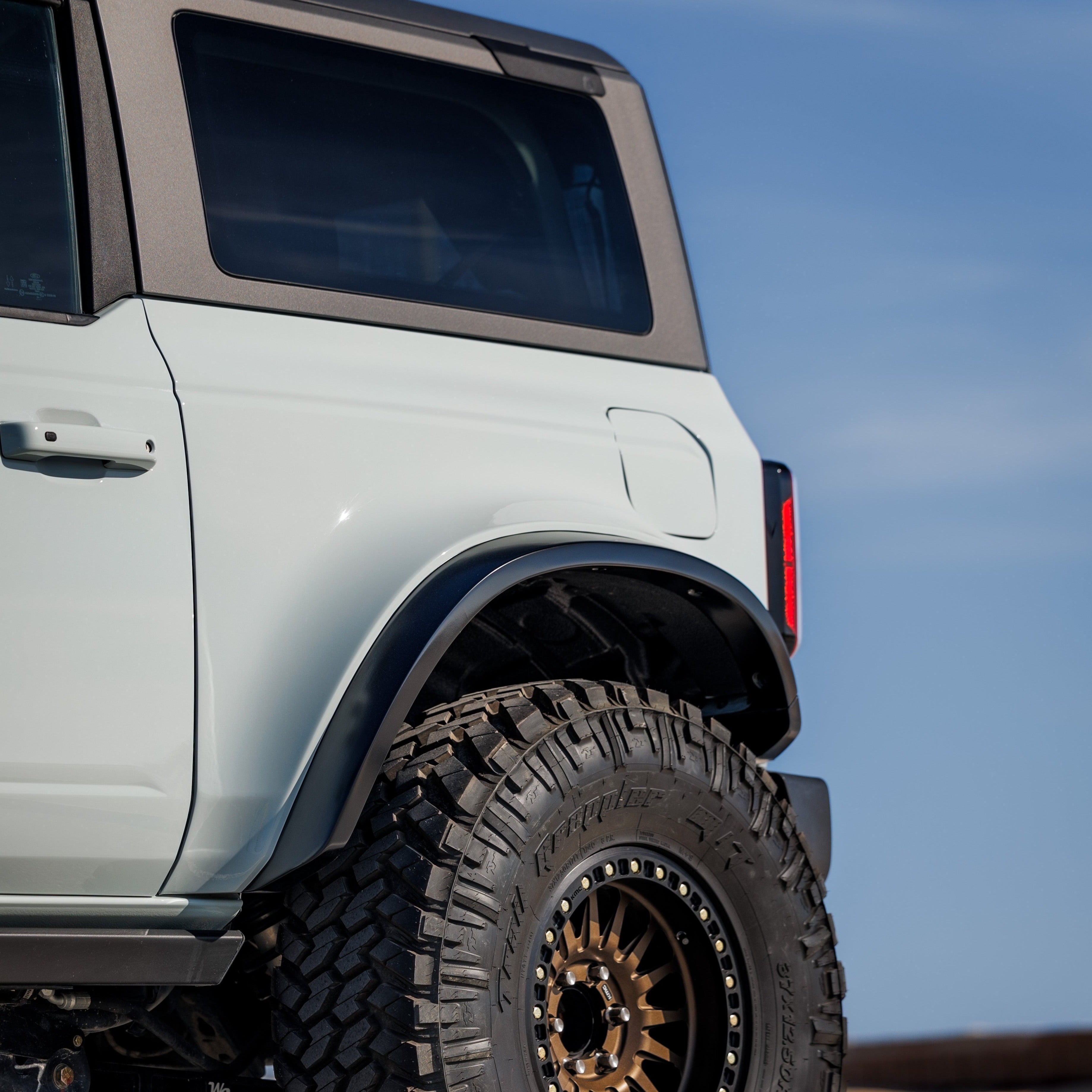 2021-2025 Ford Bronco 2-Door Rear Quarter Kit showcasing a rugged design with a durable finish and off-road tire.