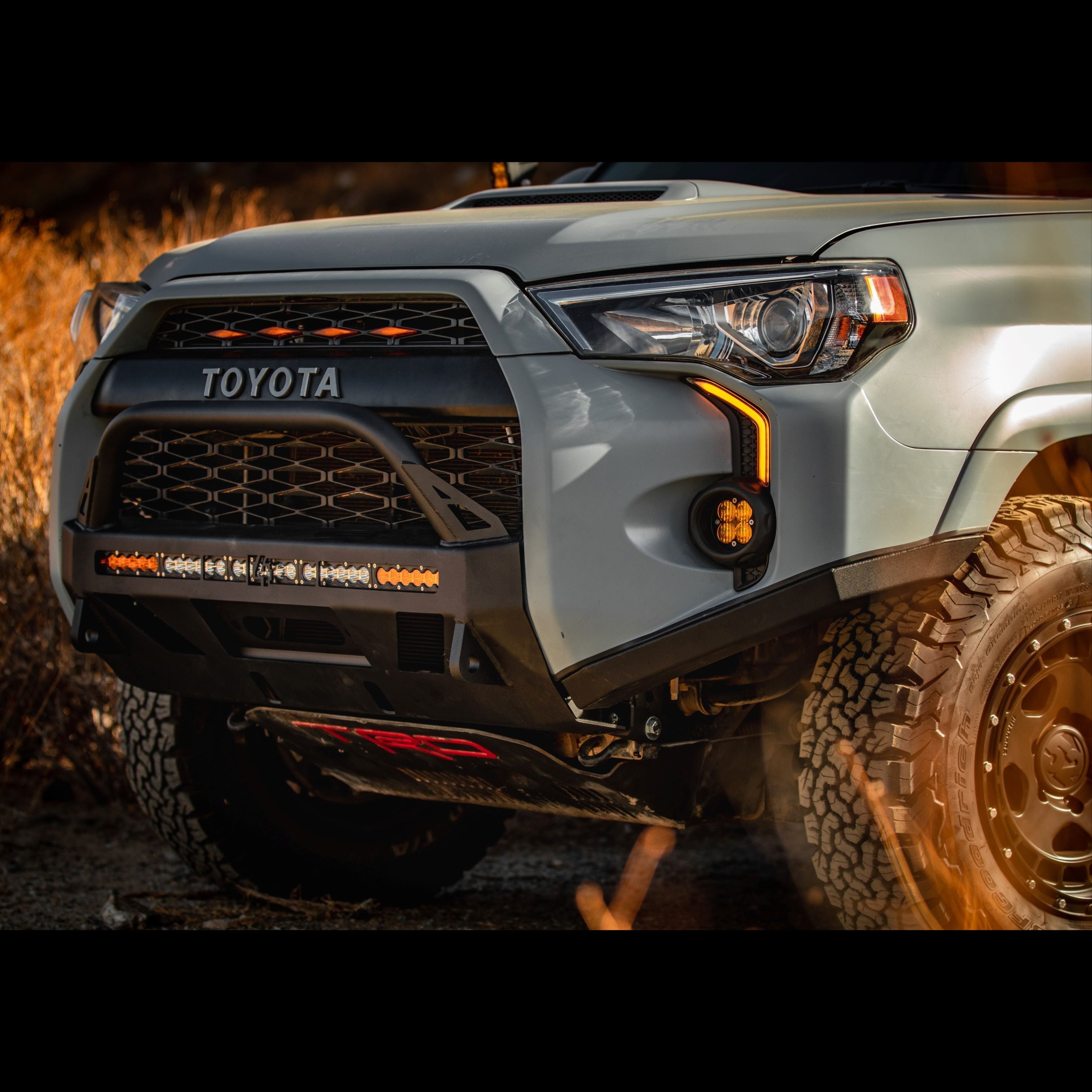 High clearance Lo Pro bumper for 2014-2024 Toyota 4Runner, featuring integrated lights and rugged design for offroad performance.