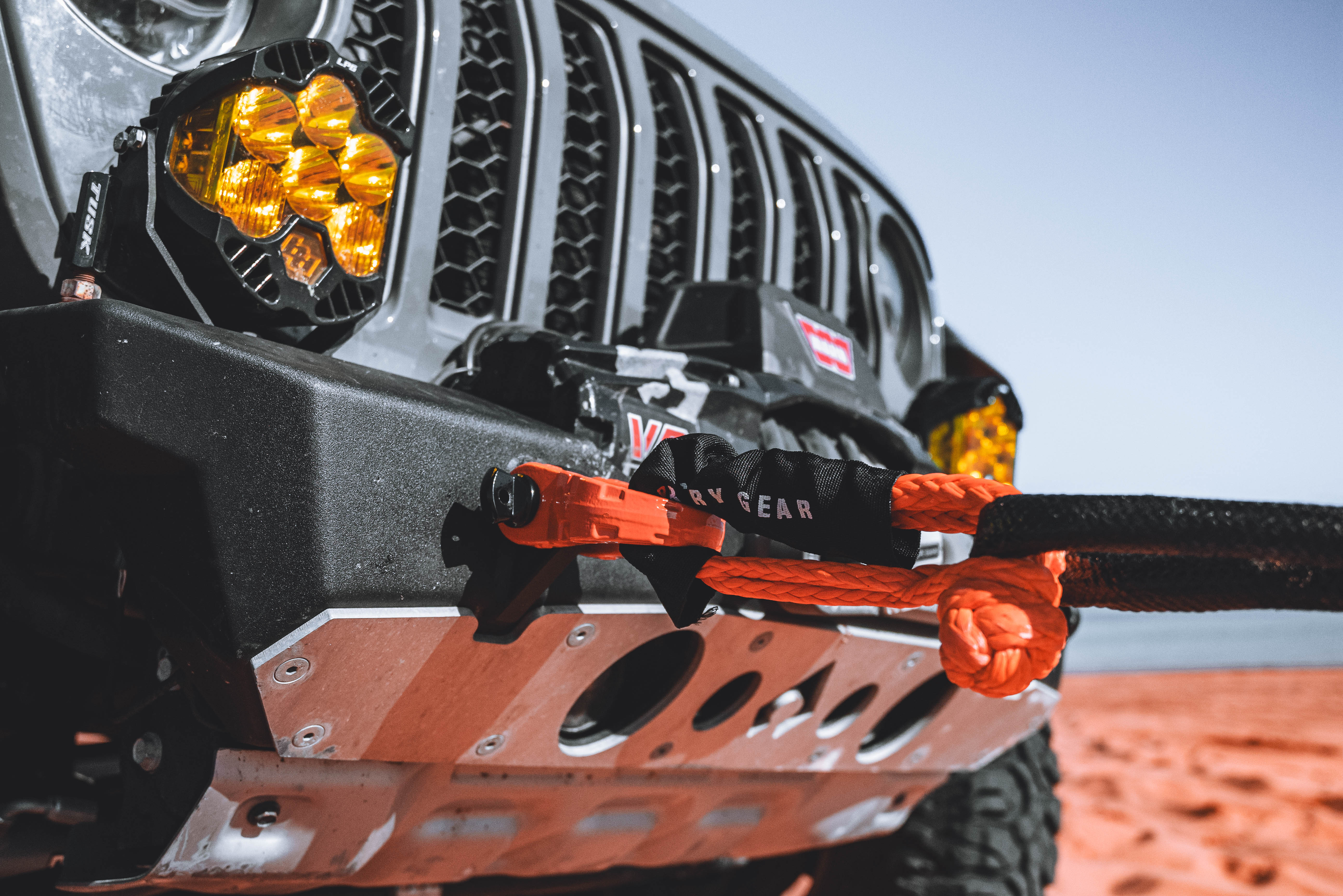 1/2-inch soft shackle attached to a rugged offroad vehicle, showcasing durability and versatility for towing and recovery.