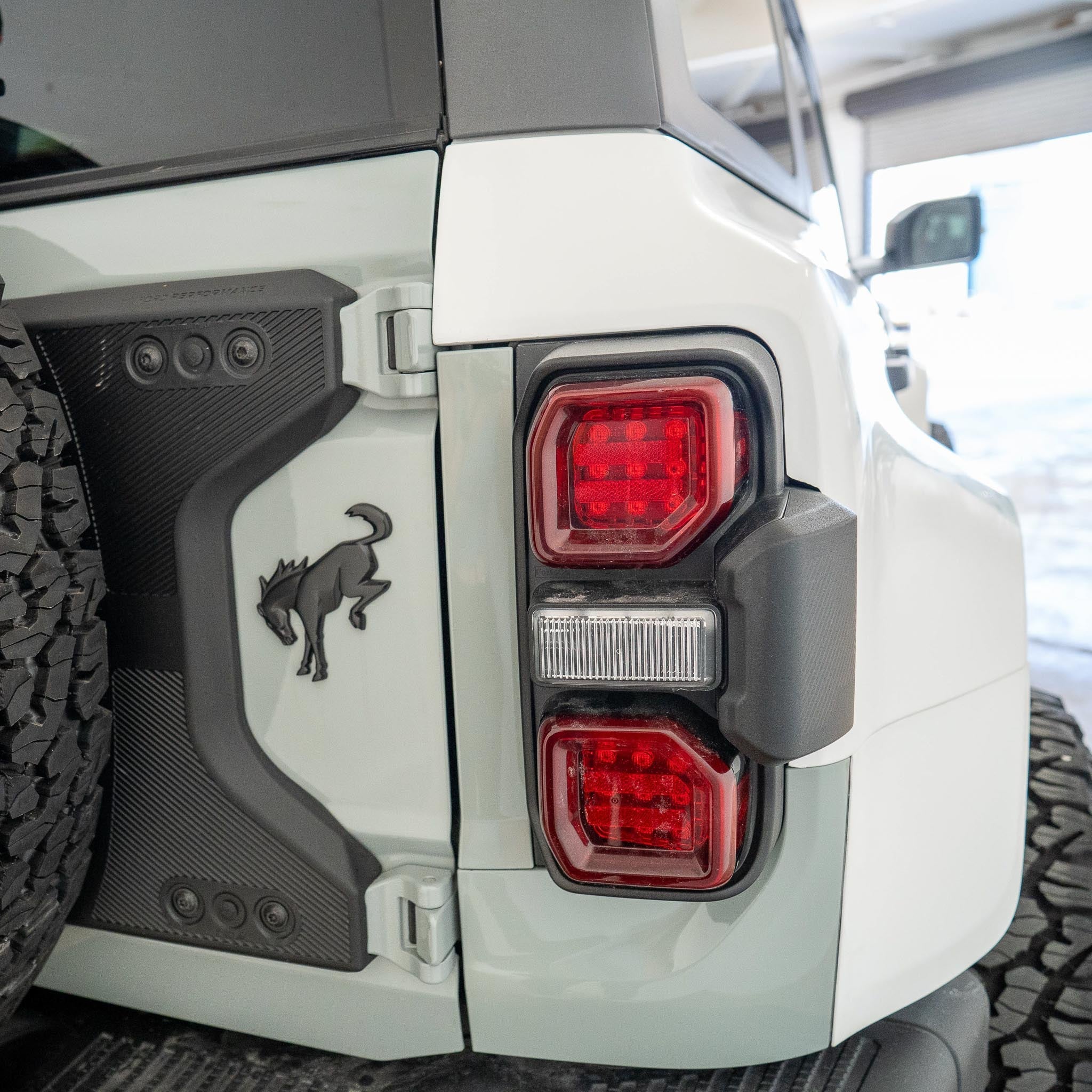 2022-2025 Ford Bronco Raptor rear quarter kit showcasing taillights and rugged design elements for off-road performance.