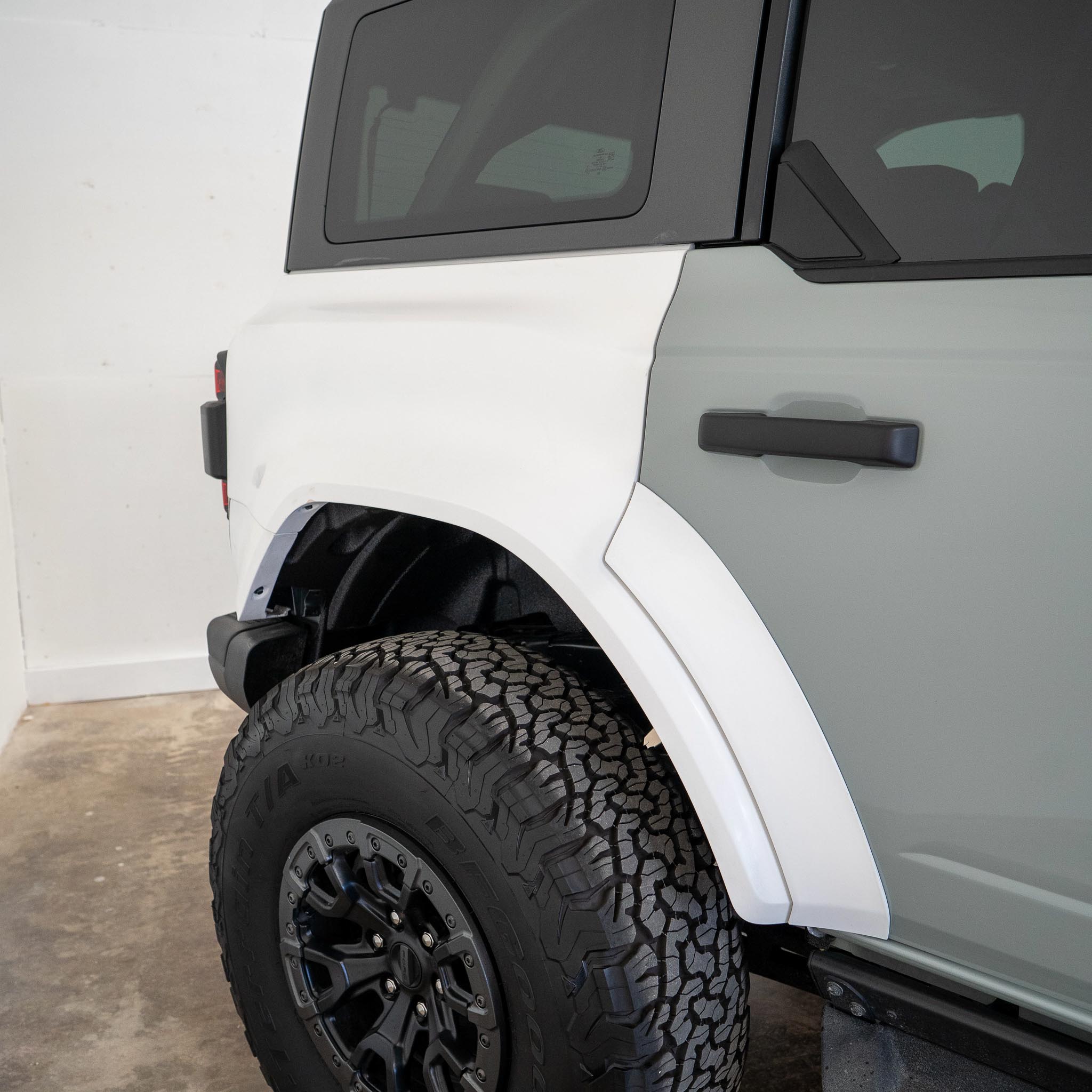 2022-2025 Ford Bronco Raptor rear quarter kit showcasing a rugged design and durable tire clearance for offroad performance.