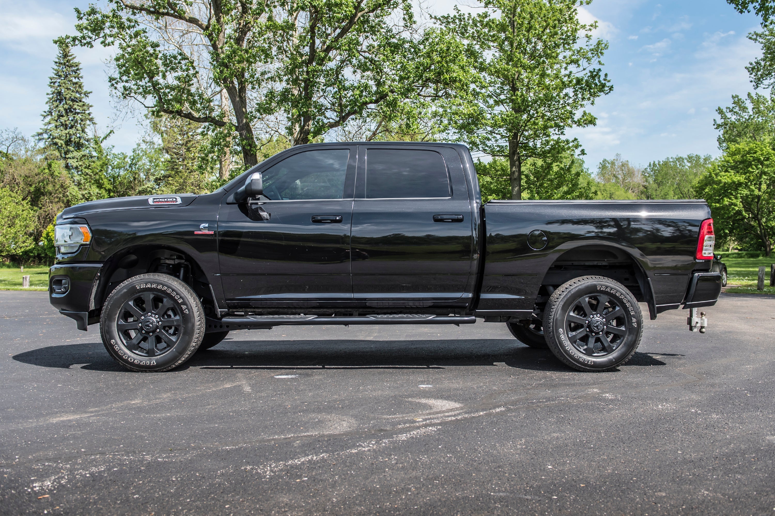 Black Ram 2500 4WD truck with a 2-inch leveling kit, showcasing enhanced stance and off-road capability.
