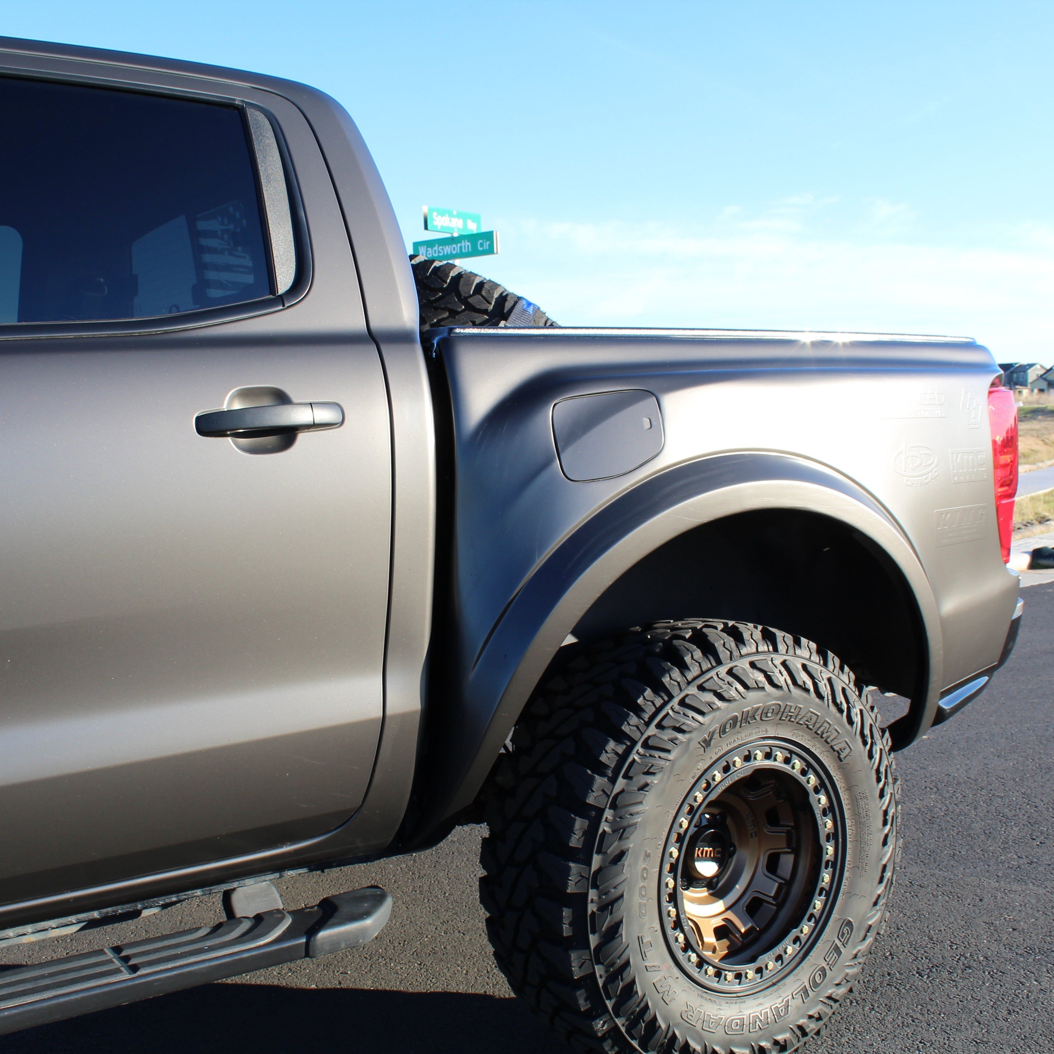 2019-2023 Ford Ranger bedsides showcasing a rugged design, mounted on a truck with offroad tires.