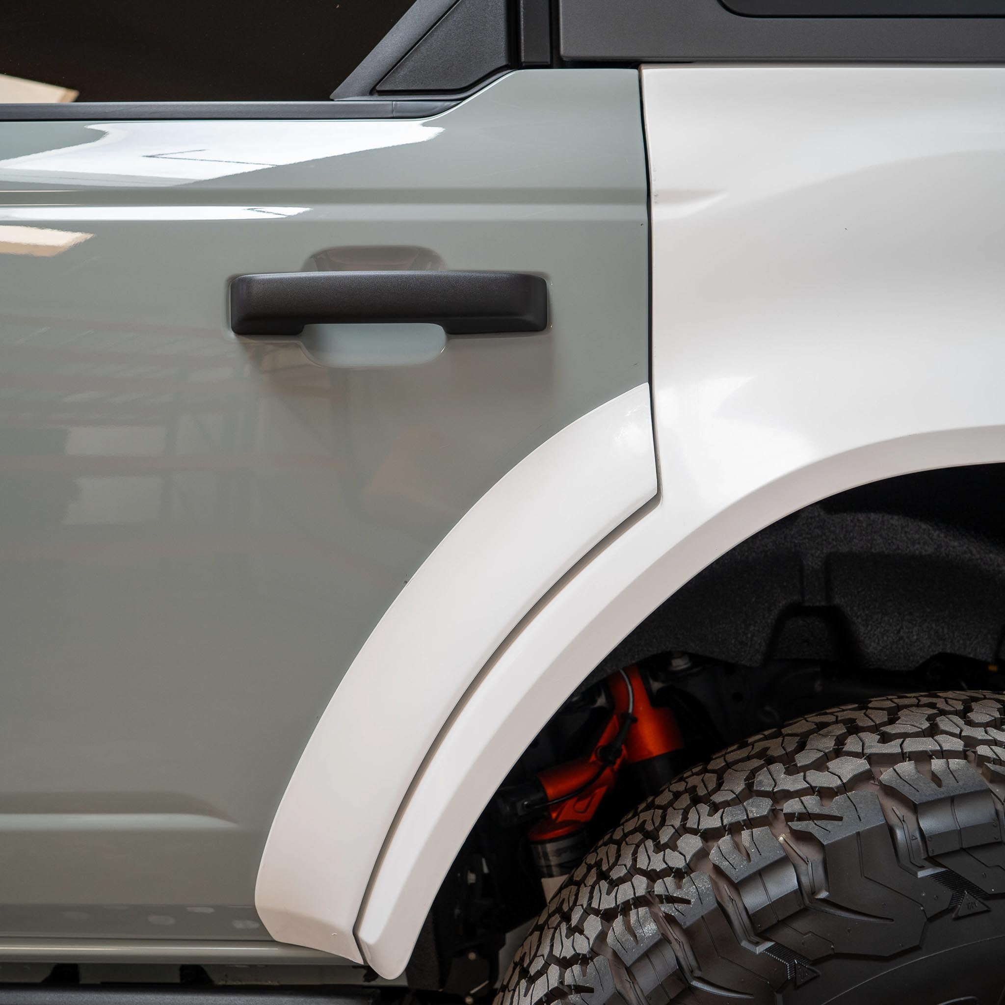 2022-2025 Ford Bronco Raptor rear quarter kit showcasing a sleek design and rugged tire clearance.