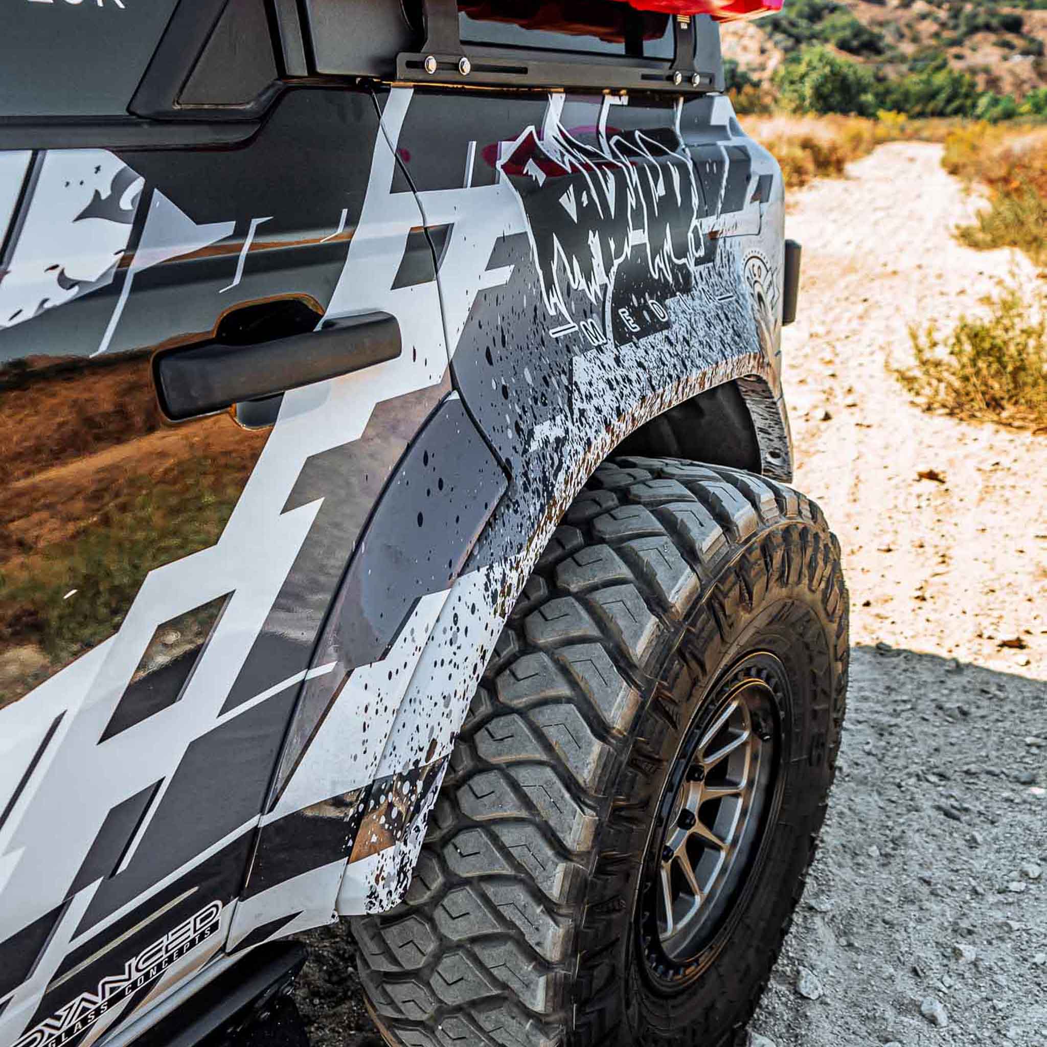 Close-up of a 2022-2025 Ford Bronco Raptor rear quarter kit showcasing rugged design and off-road tire.