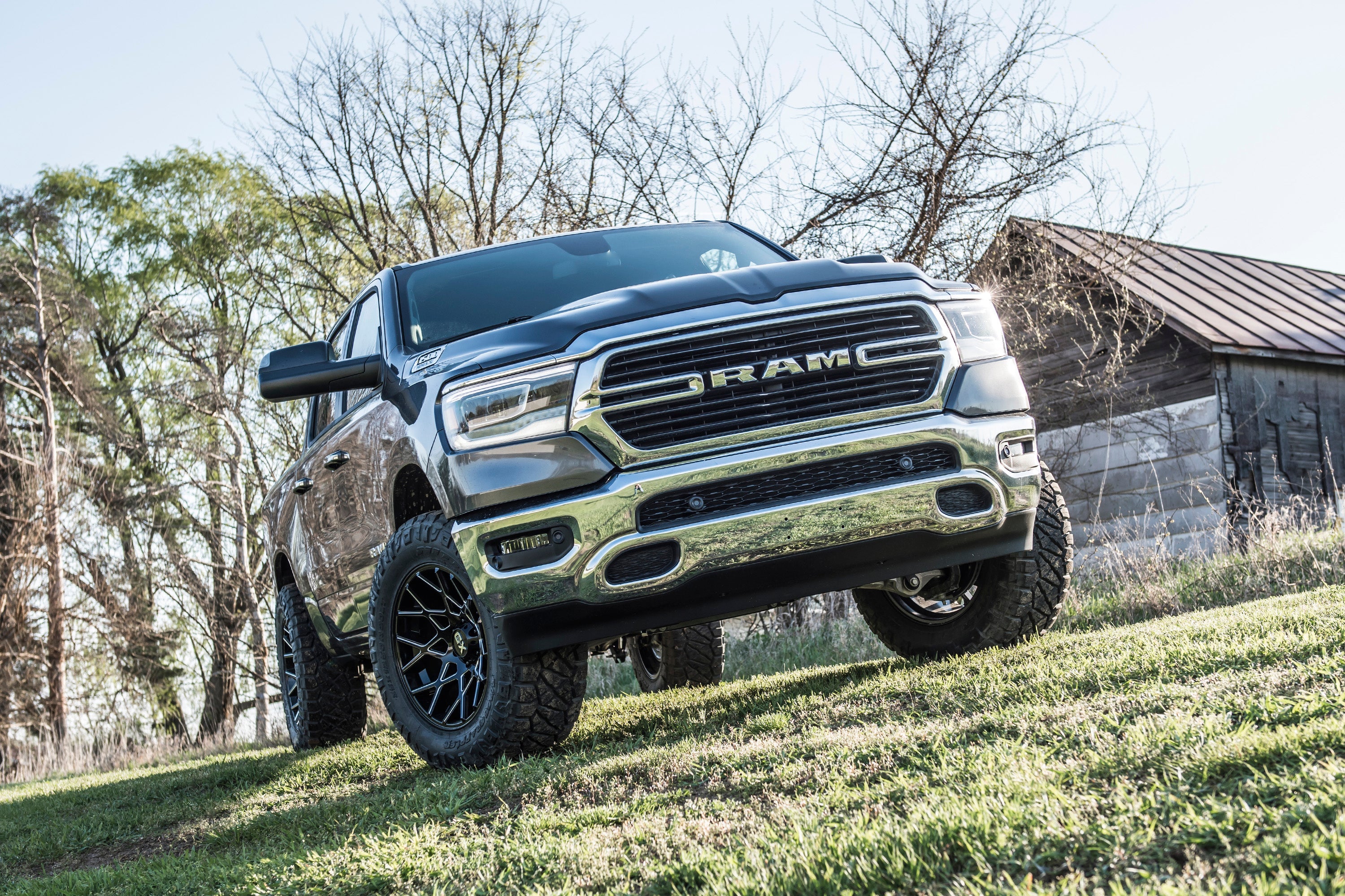 2-inch leveling kit and FOX 2.5 Performance Elite coil-over installed on a lifted Ram 1500 4WD, showcasing rugged off-road capability.