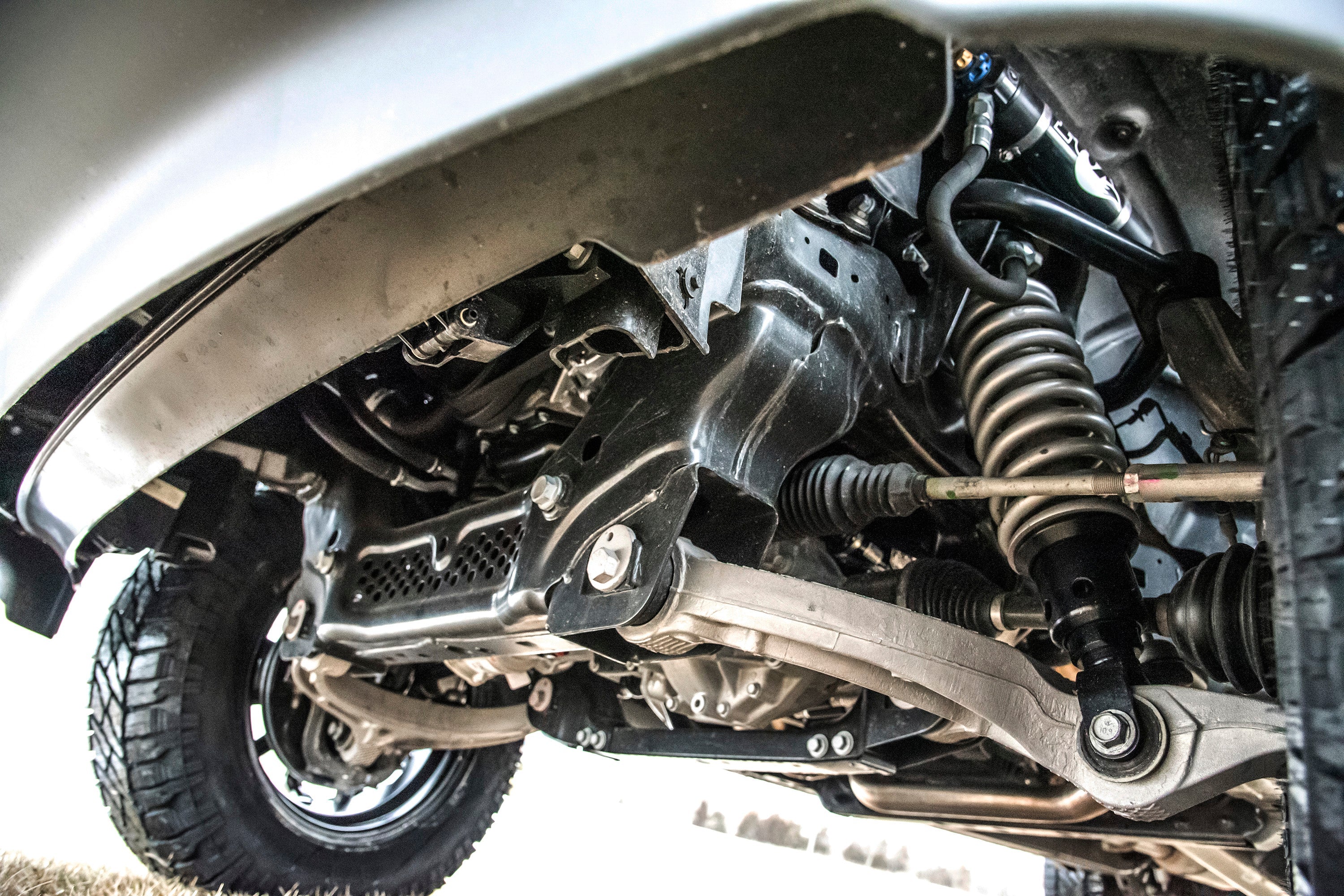 3 inch lift kit with FOX 2.5 Performance Elite coil-over installed on a Ram 1500 Rebel, showcasing suspension components.