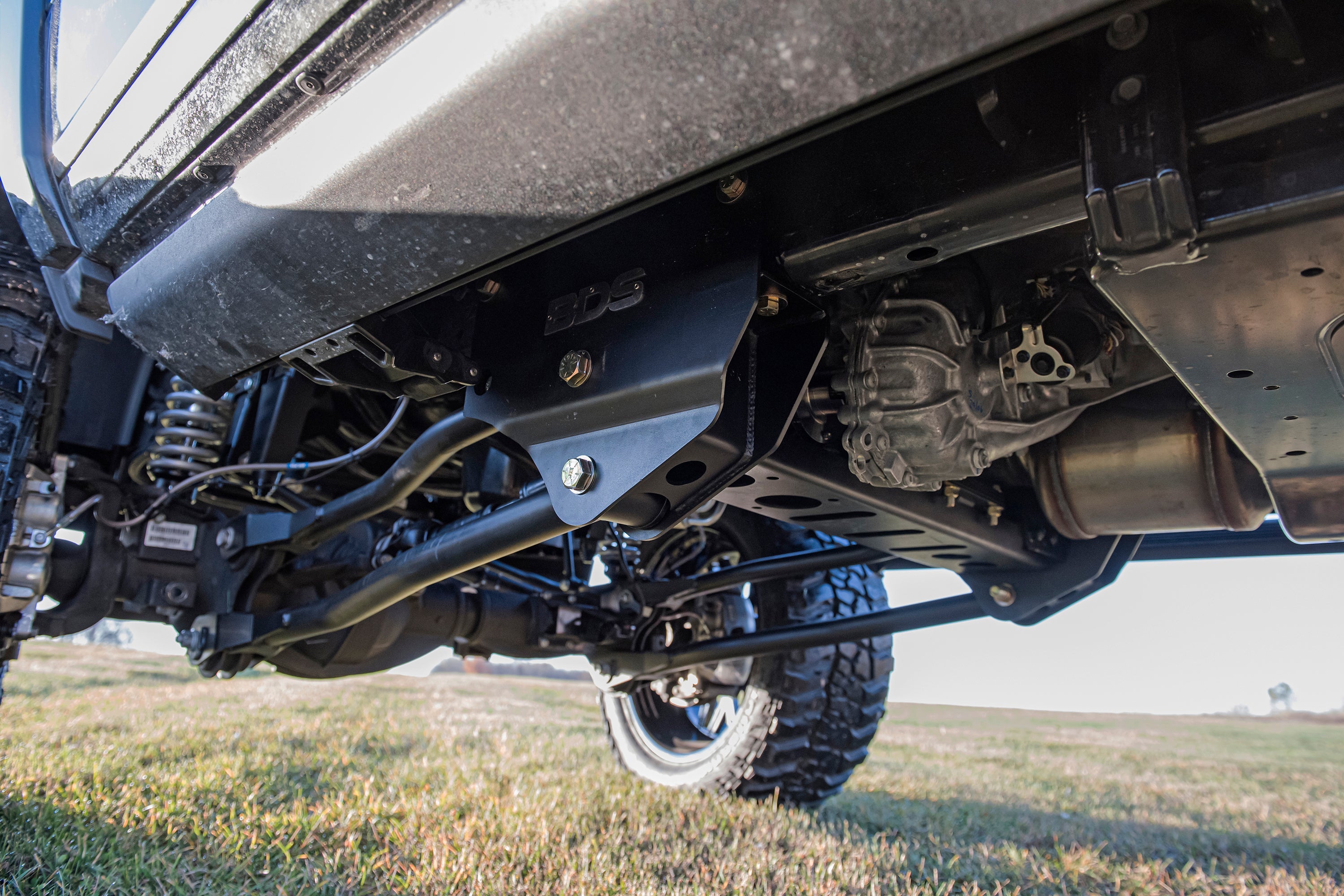 8-inch lift kit with 4-link system installed on a 2019-2024 Ram 2500 4WD diesel truck, showcasing undercarriage components.