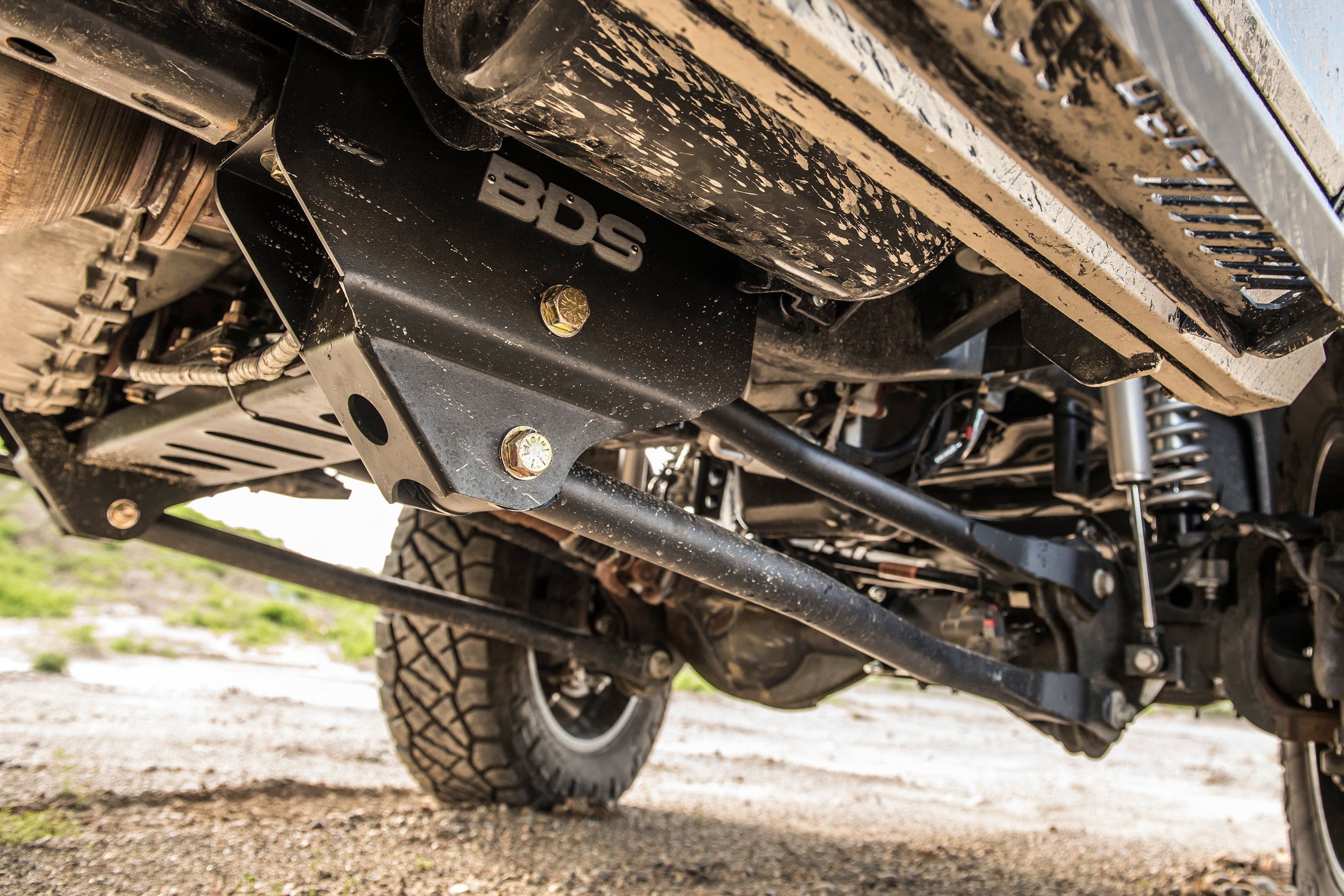 4-inch lift kit with 4-link suspension installed on a Ram 2500 4WD diesel truck, showcasing undercarriage components.