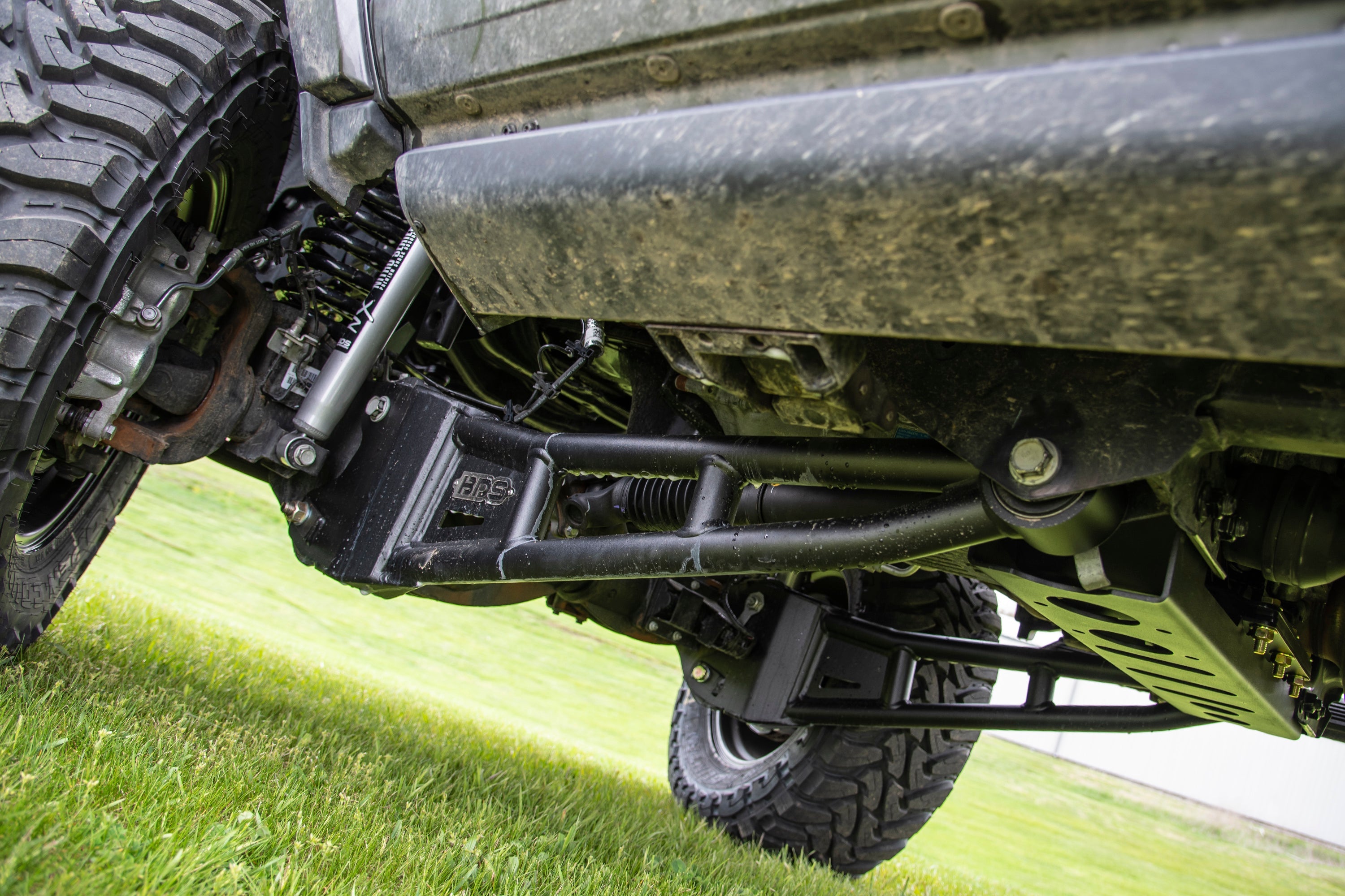 5.5 inch lift kit installed on a Ram 3500, showcasing the radius arm and undercarriage components for enhanced offroad performance.