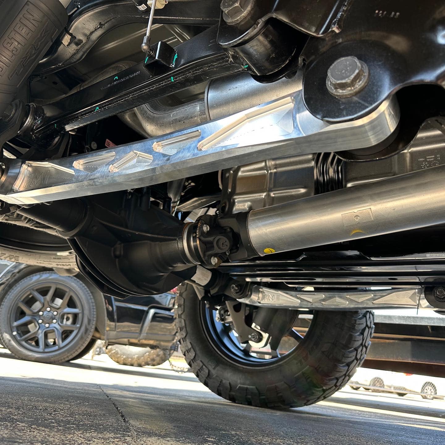 2025 Ram RHO rear suspension arm kit made of billet aluminum, showcasing durable construction and performance features.