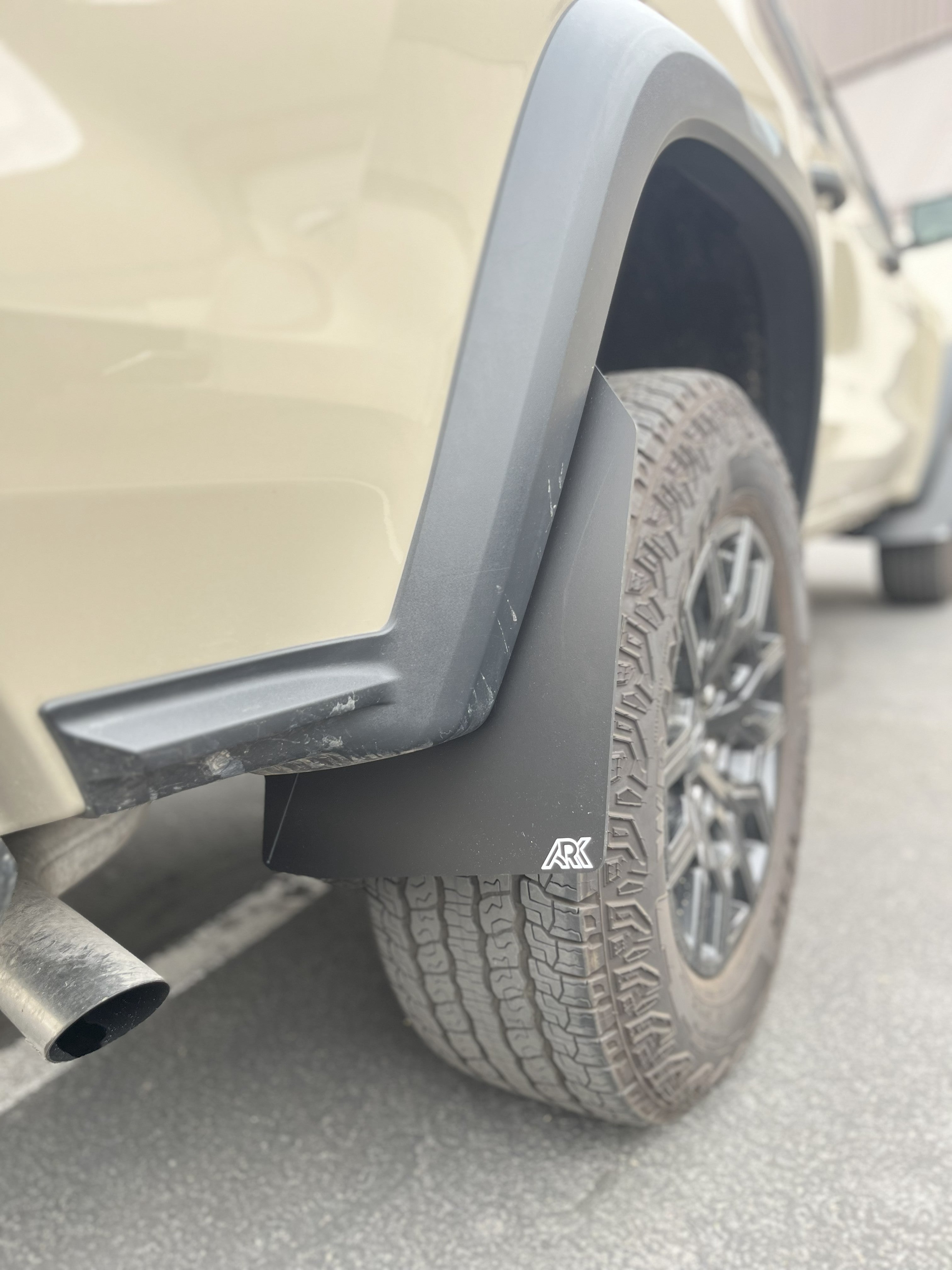 2023+ Chevy Colorado ZR2/Trailboss TriXPoly Mid Mudflaps installed on a vehicle, showcasing rugged design and tire protection.