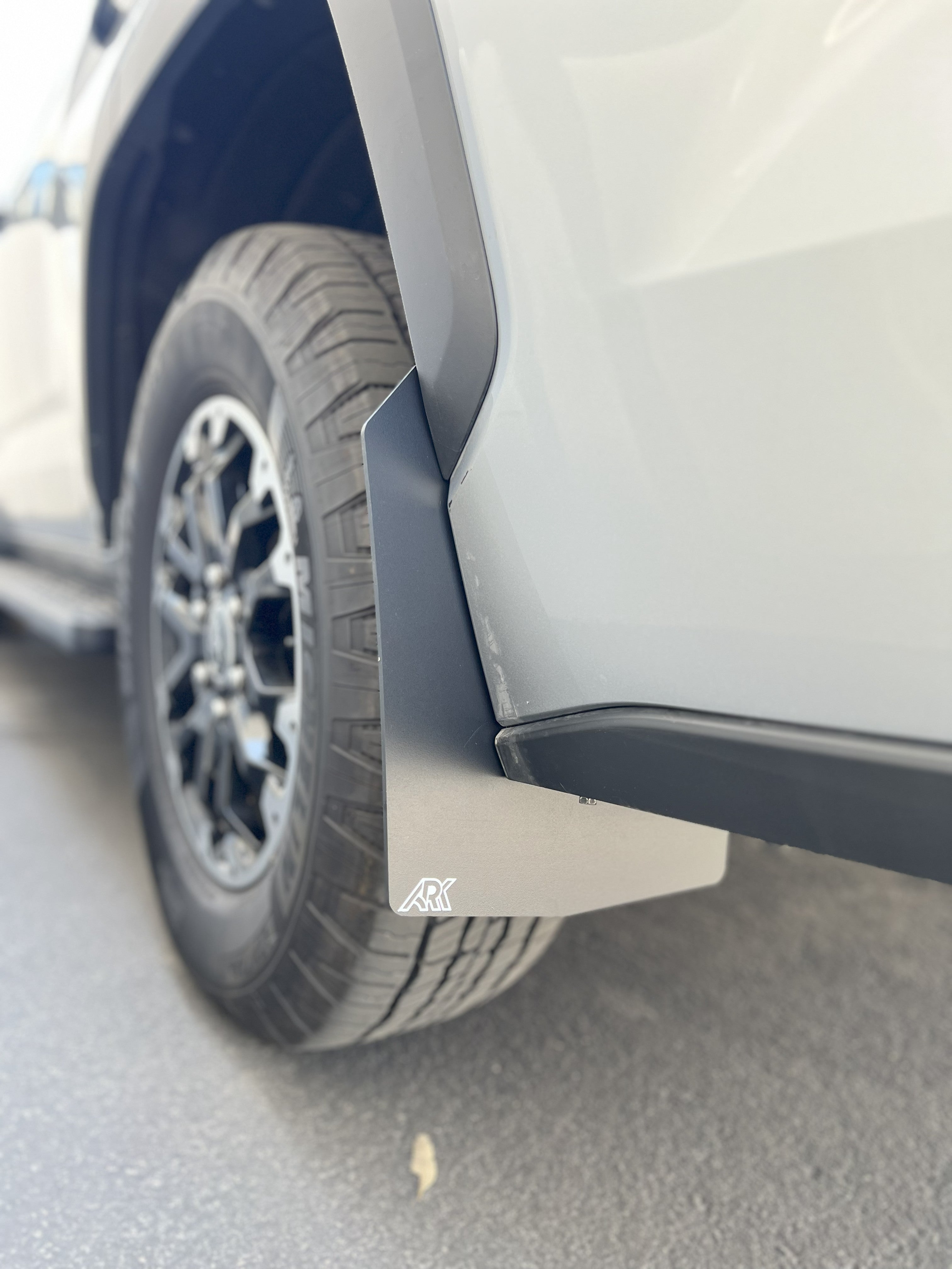 2022+ Toyota Sequoia TriXPoly Mid Mud Flaps installed on a vehicle, showcasing durability and protection against mud and debris.