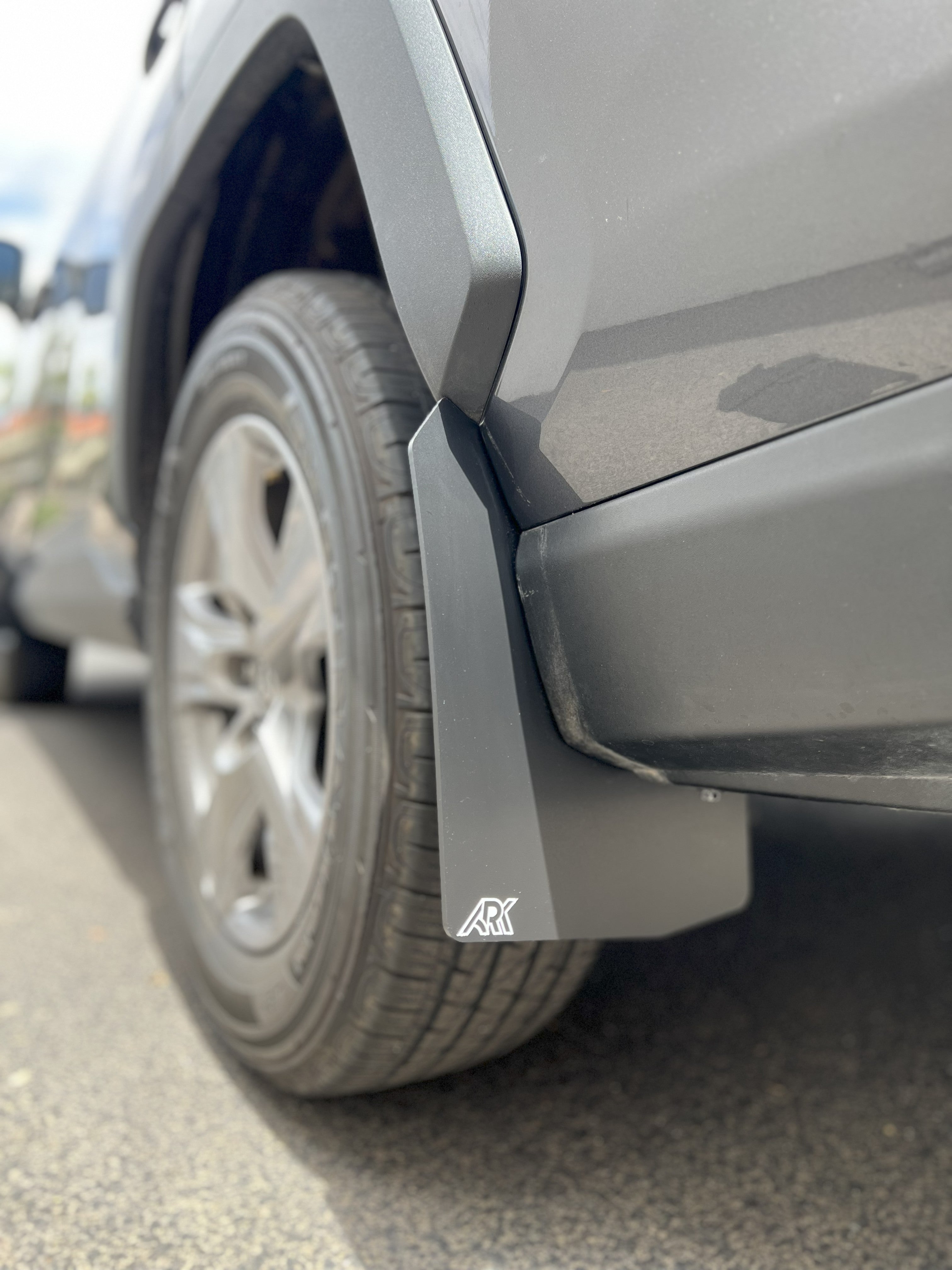 TriXPoly Mid Mudflaps for 2019-2025 Toyota RAV4 Gen 5, designed to protect against mud and debris. Durable and stylish fit.