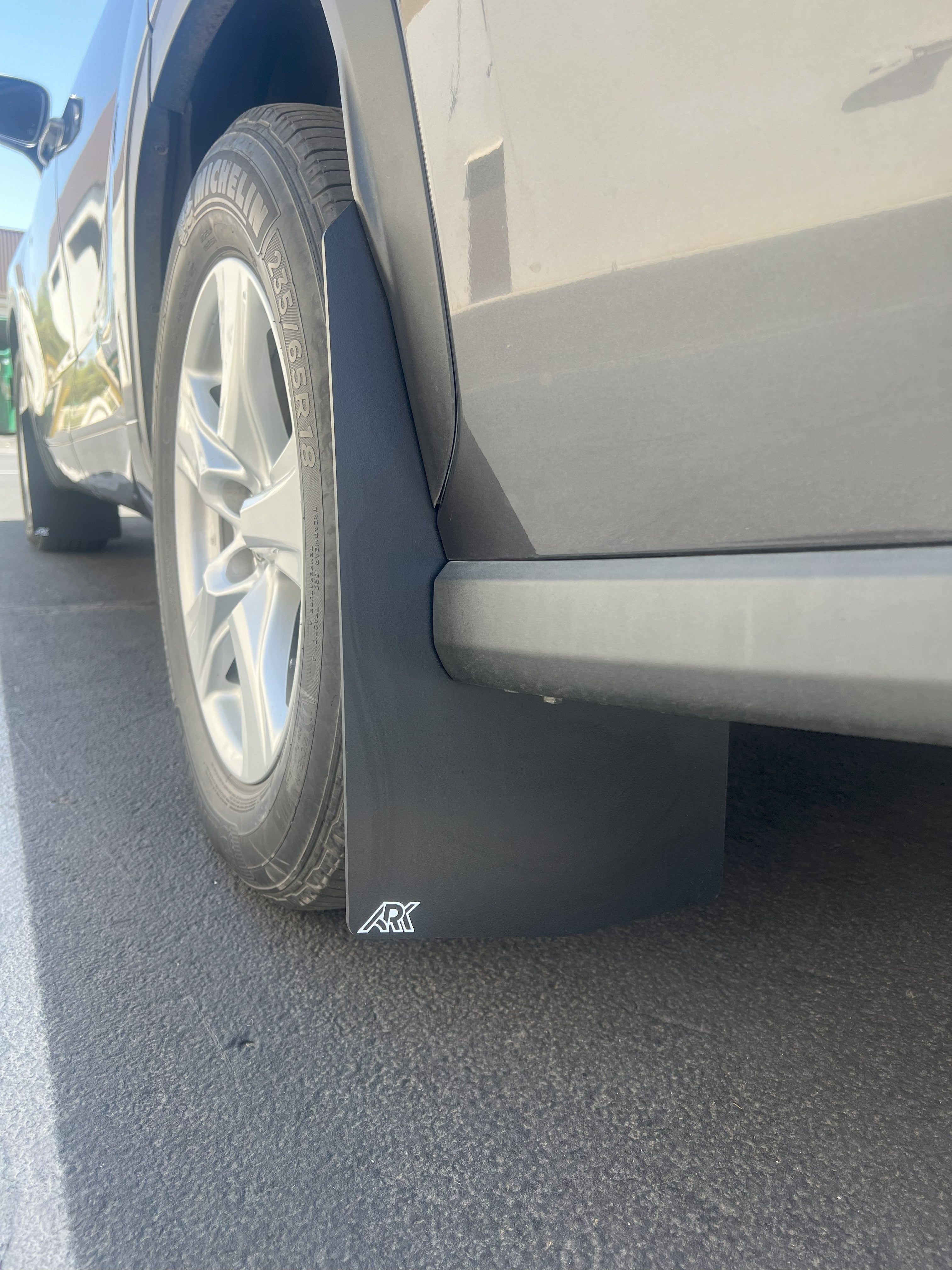 2020+ Toyota Highlander TriXPoly Mudflaps installed on a vehicle, providing protection against mud and debris.