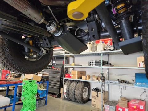 Rear differential skid plate for 2021 and newer Ford Bronco, showcasing durable protection in an offroad setting.