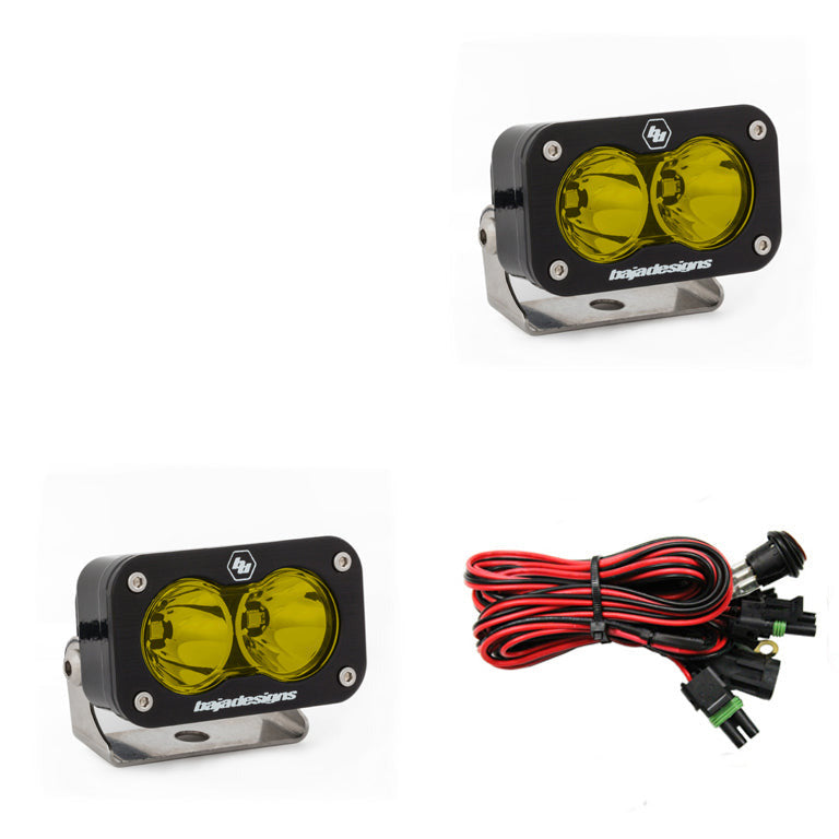 Baja Designs S2 Pro LED light pair with yellow lenses and mounting brackets, ideal for off-road vehicles.
