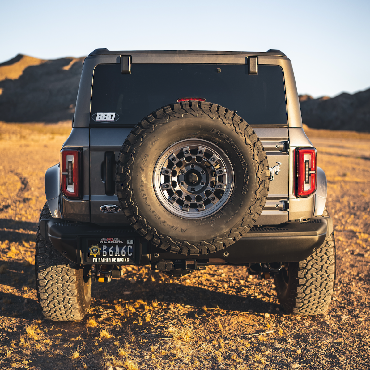 2021-2025 Ford Bronco 4-Door Rear Quarter Kit installed on a Bronco in a desert setting, showcasing rugged off-road capability.