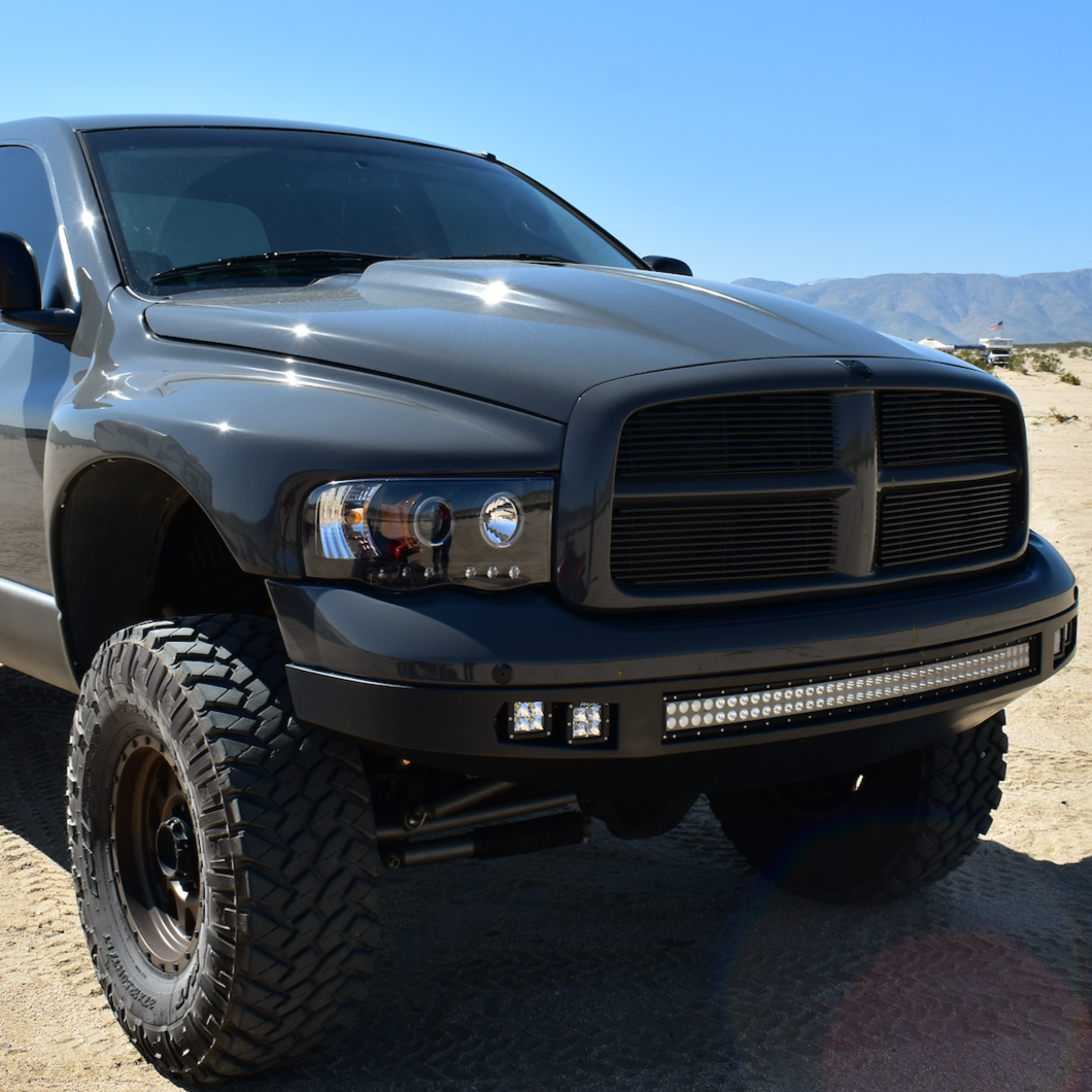2003-2005 Dodge Ram fenders showcasing a rugged, off-road truck with a sleek black finish and aggressive stance.
