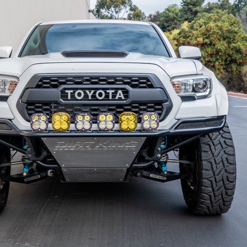 2016-2023 Toyota Tacoma fenders showcasing a rugged front end with off-road lights and a bold grille design.