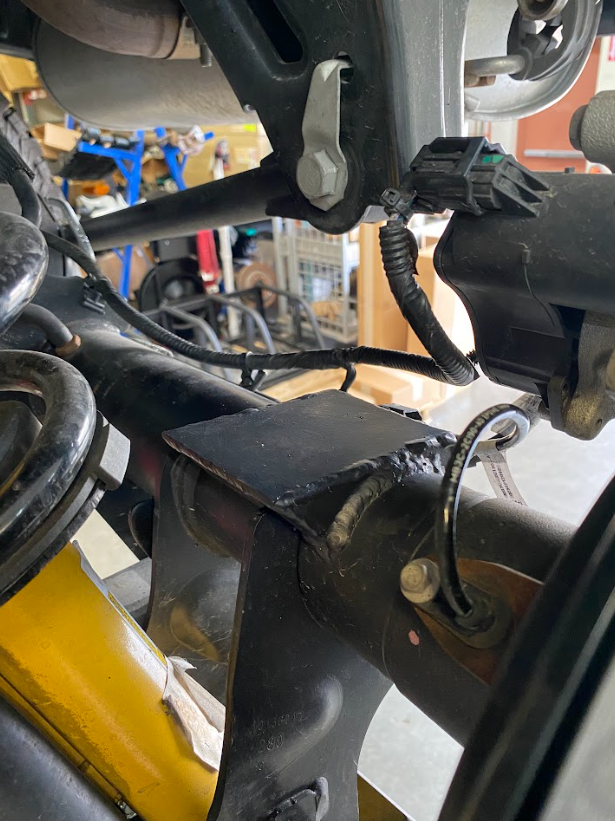 2021 and up Bronco rear hydraulic bump stop kit installed on suspension components for enhanced offroad performance.