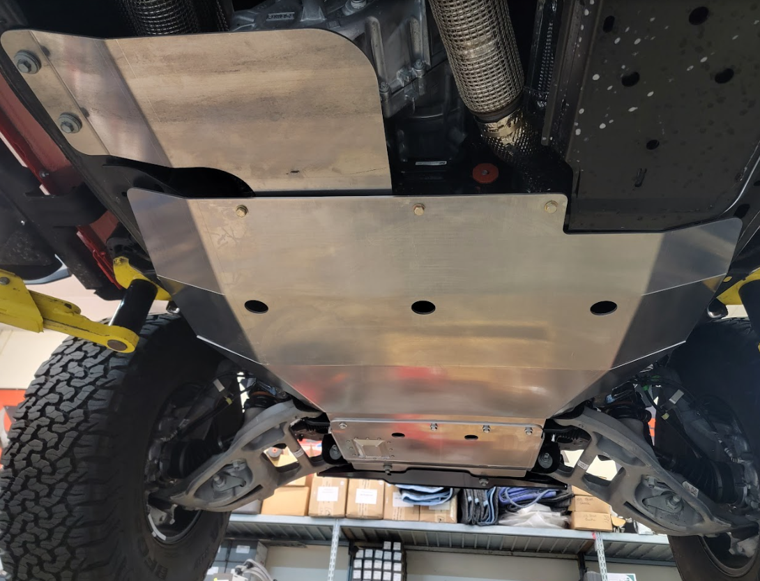2022-UP Ford Bronco Raptor skid plate installed, showcasing durable aluminum construction for undercarriage protection.