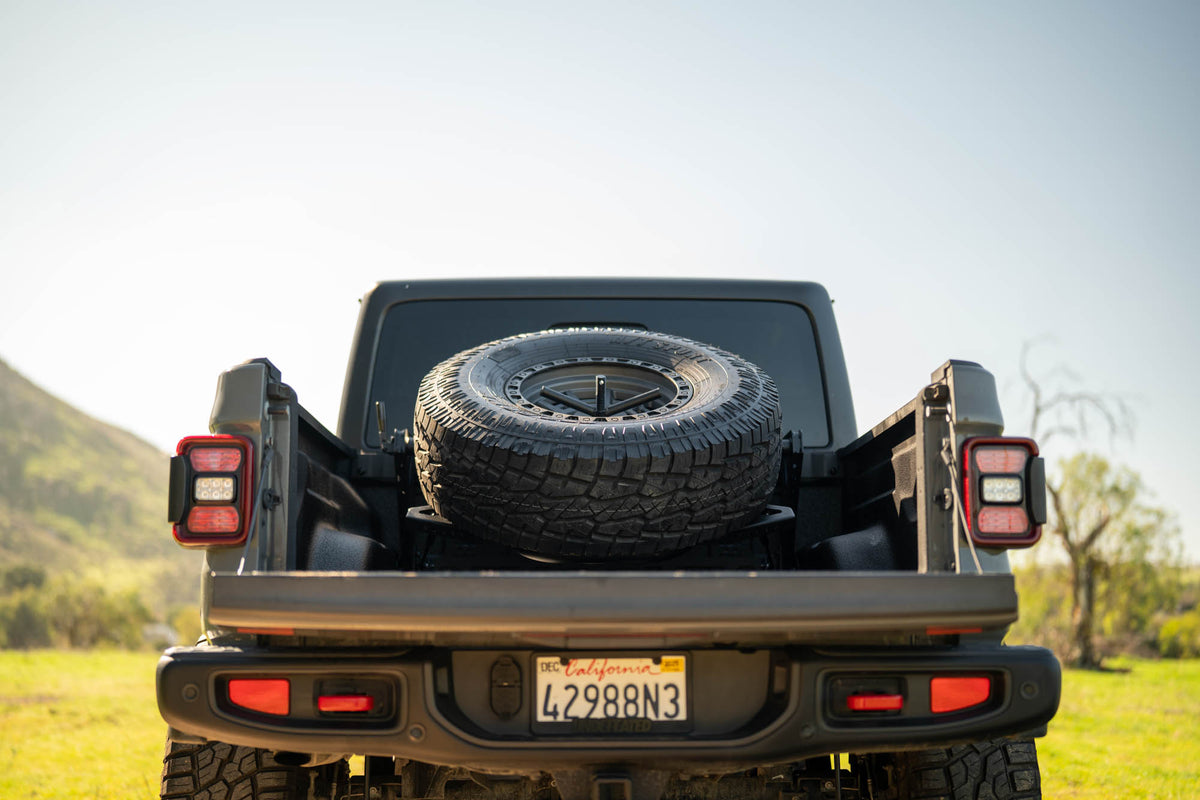 2020 2025 Jeep Gladiator JT Adjustable In Bed Tire Carrier DV8 Offroad